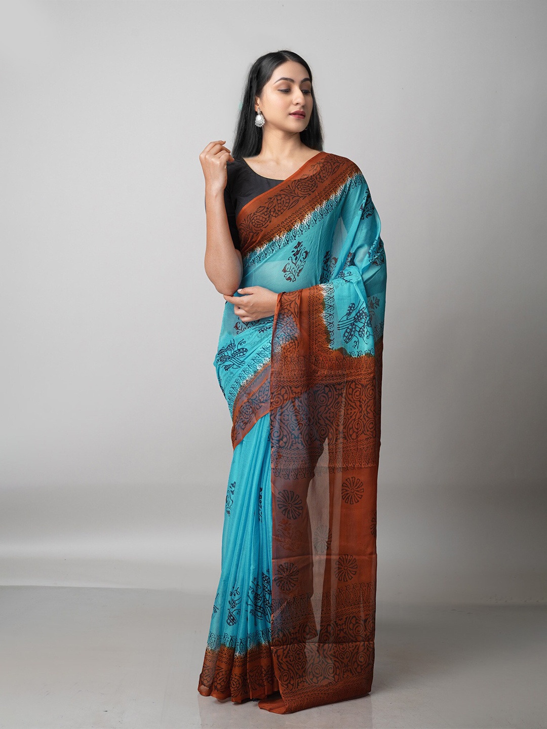 

Unnati Silks Blue & Brown Floral Block Print Saree