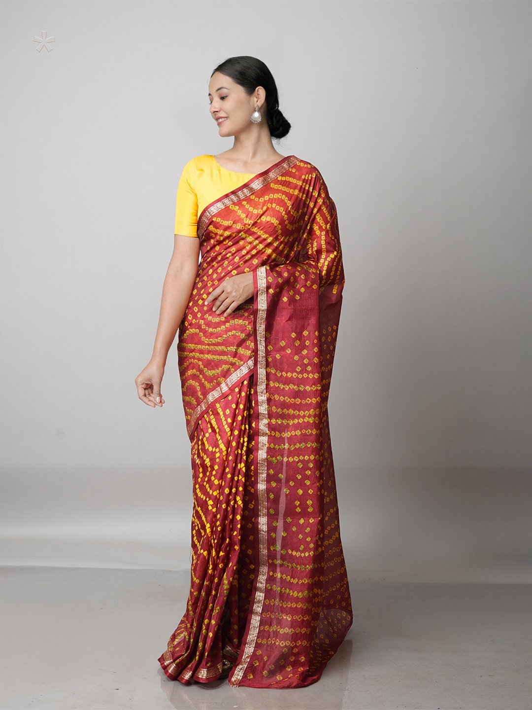 

Unnati Silks Maroon & Yellow Zari Bandhani Saree