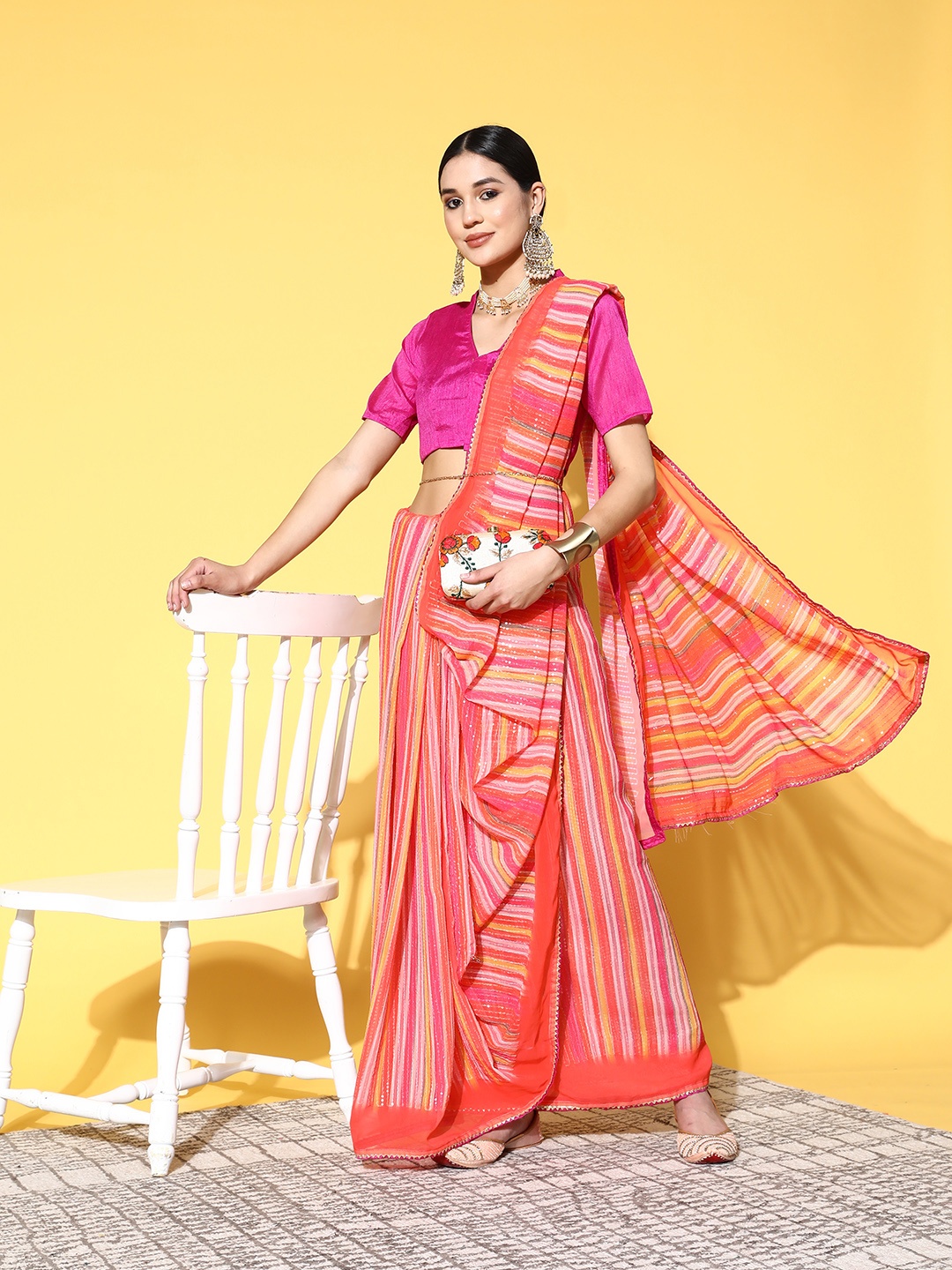 

Kalista Orange & Pink Striped Sequined Embellished Saree
