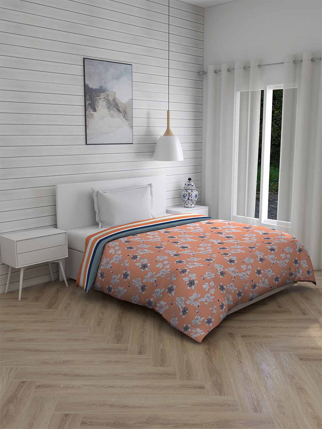 

Layers Orange & White Floral Mild Winter 120 GSM Cotton Single Bed Comforter