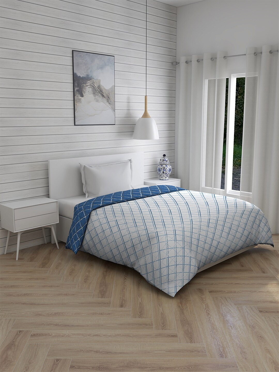 

Layers Blue & White Geometric Mild Winter 120 GSM Cotton Single Bed Comforter