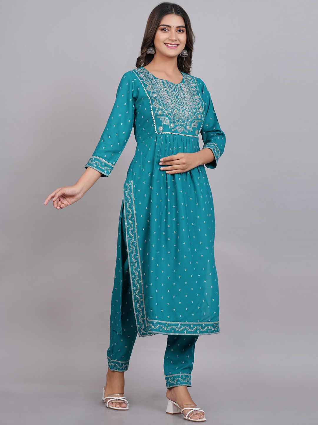

Mollar Women Turquoise Blue Ethnic Embroidered Pleated Mirror Work Kurta with Trousers