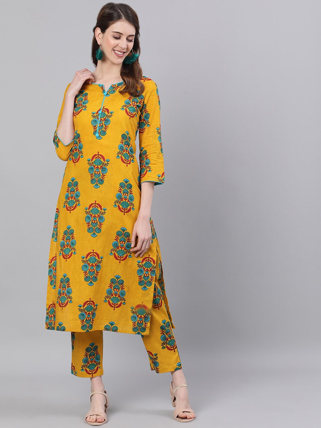 

antaran Women Mustard Yellow Floral Printed Pure Cotton Kurta with Trousers