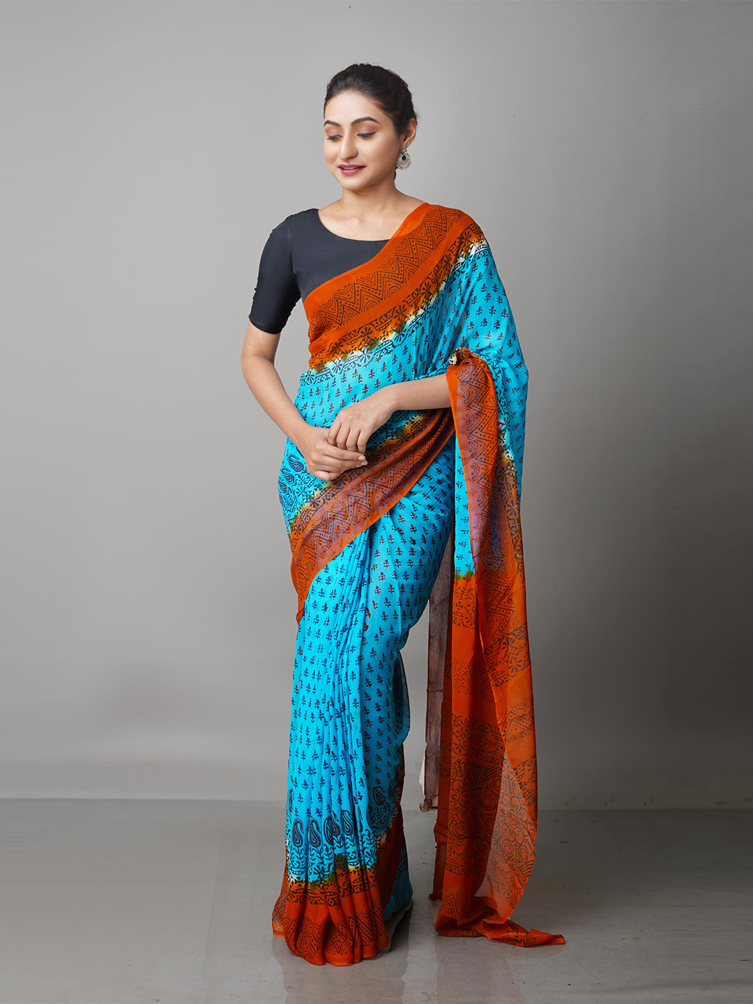 

Unnati Silks Blue & Orange Ethnic Motifs Block Print Saree