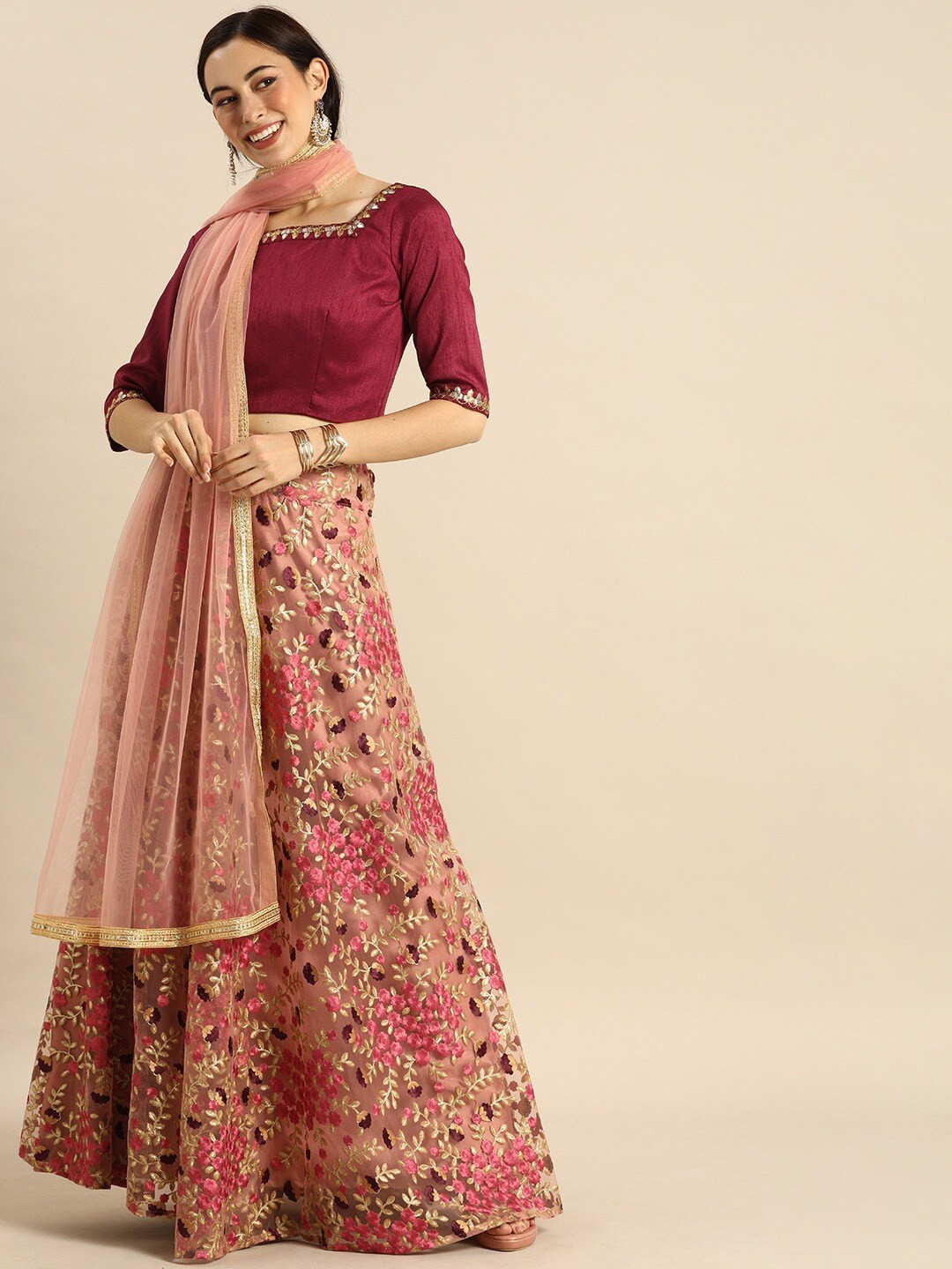 

Fusionic Peach-Coloured & Gold-Toned Embroidered Semi-Stitched Lehenga & Unstitched Blouse With Dupatta