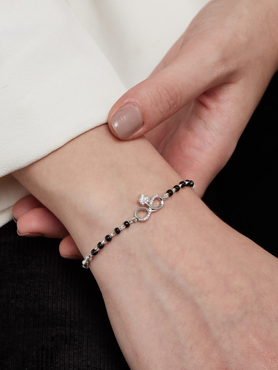 

Zavya Women Silver-Toned & Black Silver Rhodium-Plated Charm Bracelet