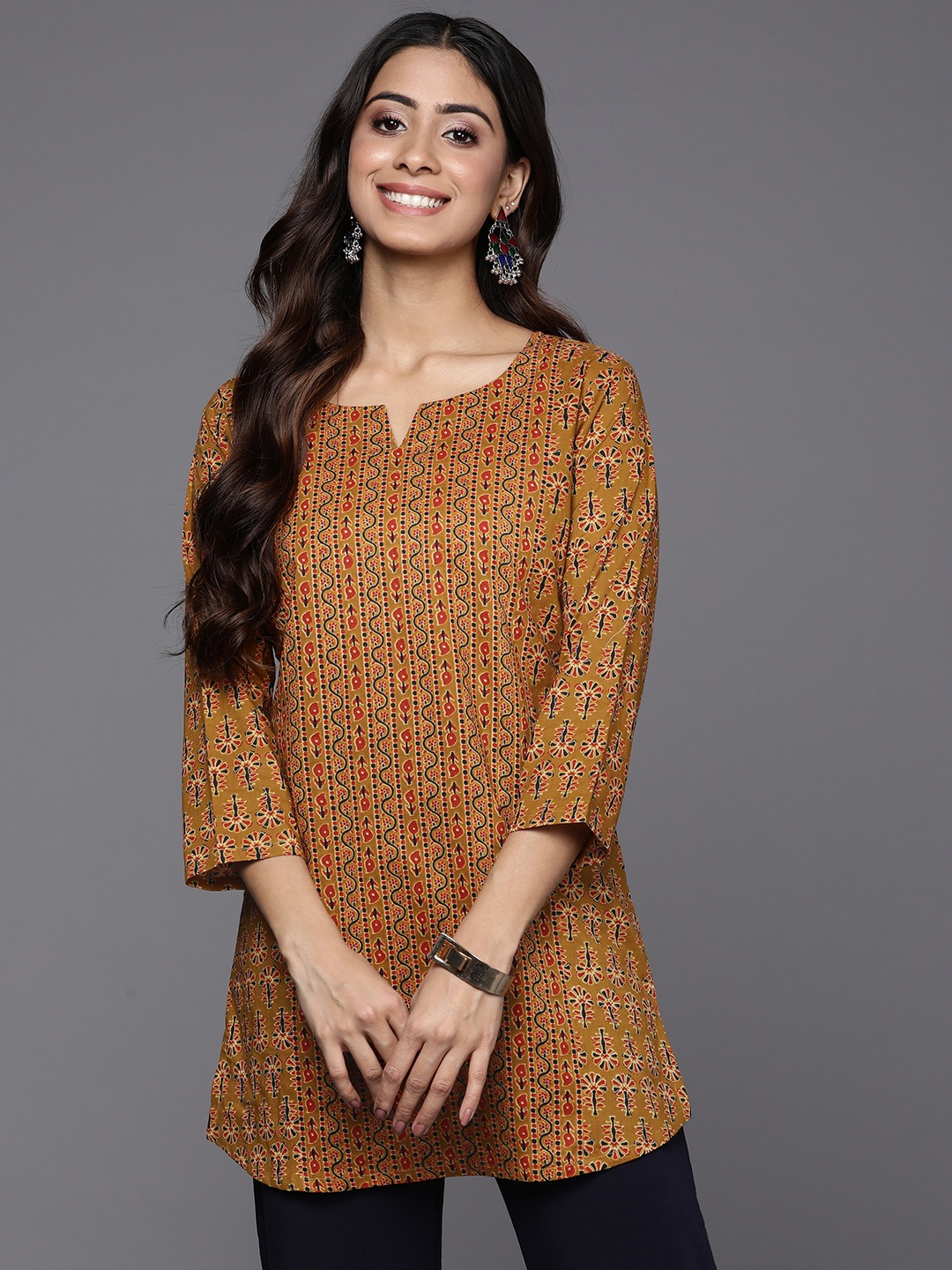 

Indo Era Pure Cotton Ethnic Motifs Printed Regular Top, Mustard