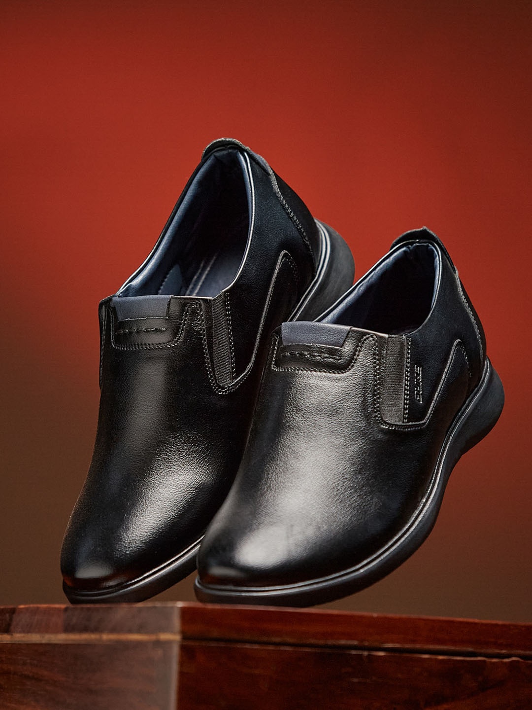 

Duke Men Black Solid Formal Slip-On Shoes