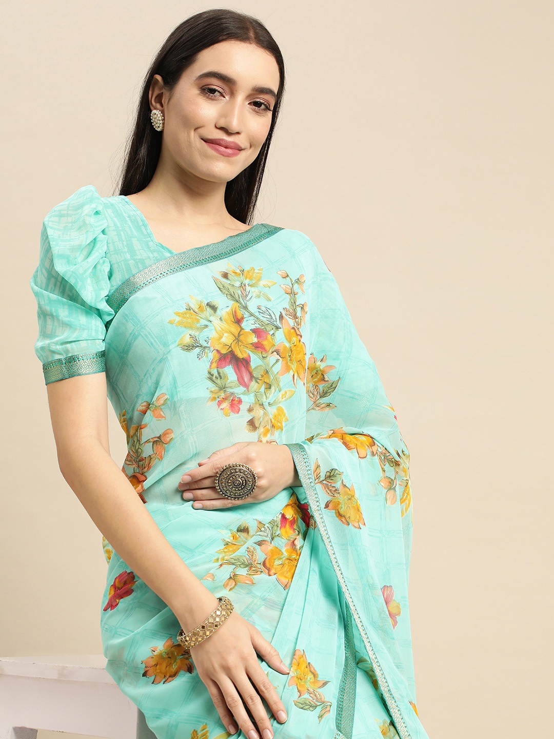 

Mitera Teal Floral Pure Georgette Saree