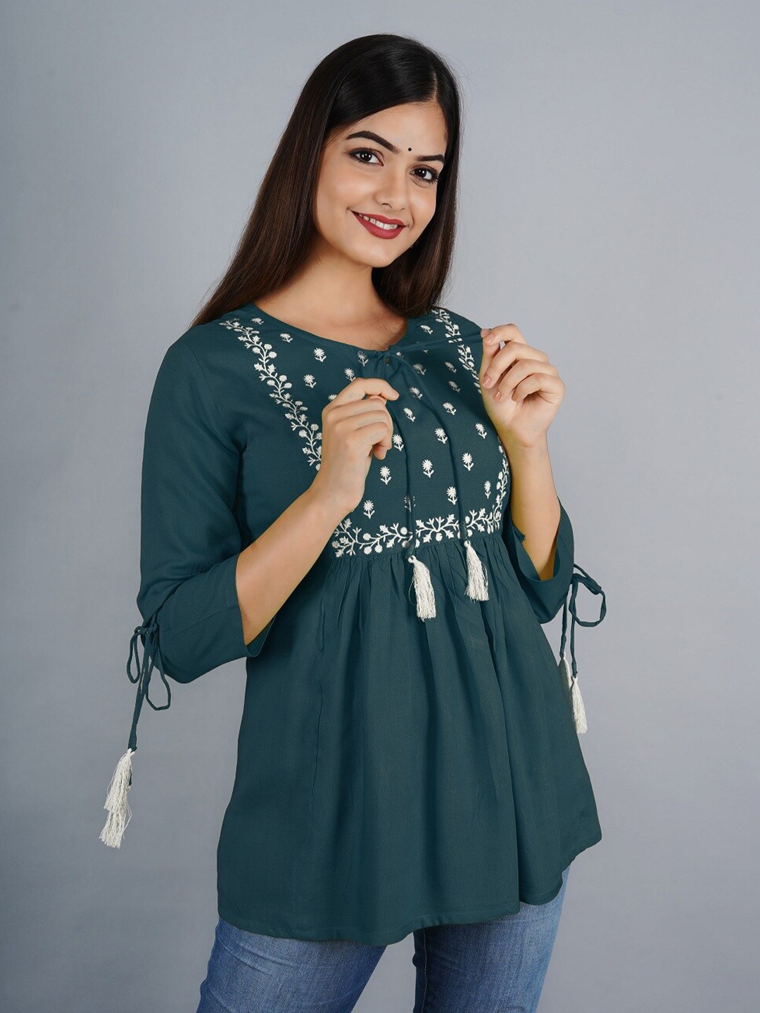 

Ashlee Women Green & White Floral Embroidered Tie-Up Neck Empire Top