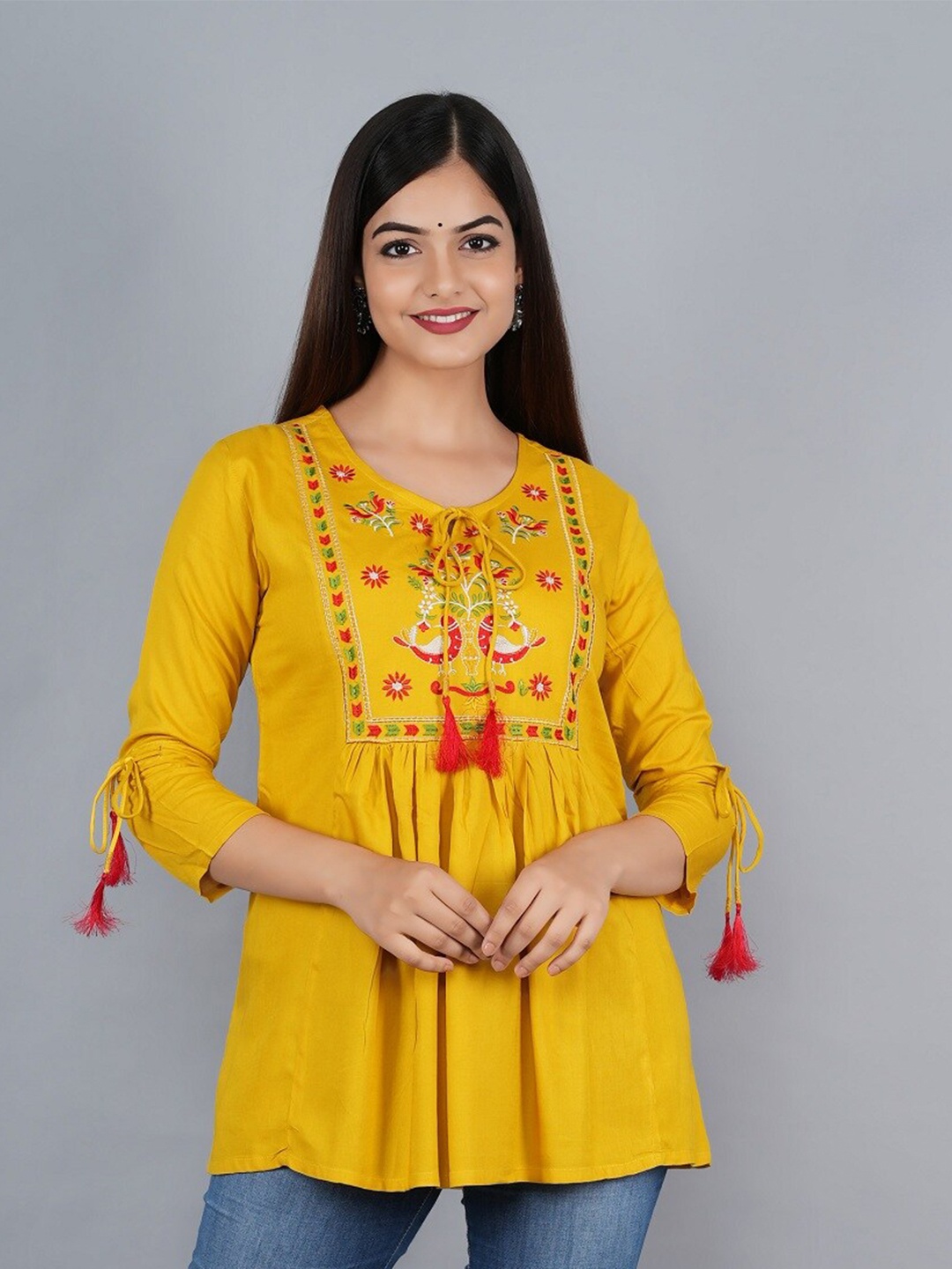 

Ashlee Women Mustard Yellow & Red Floral Embroidered Tie-Up Neck Empire Top