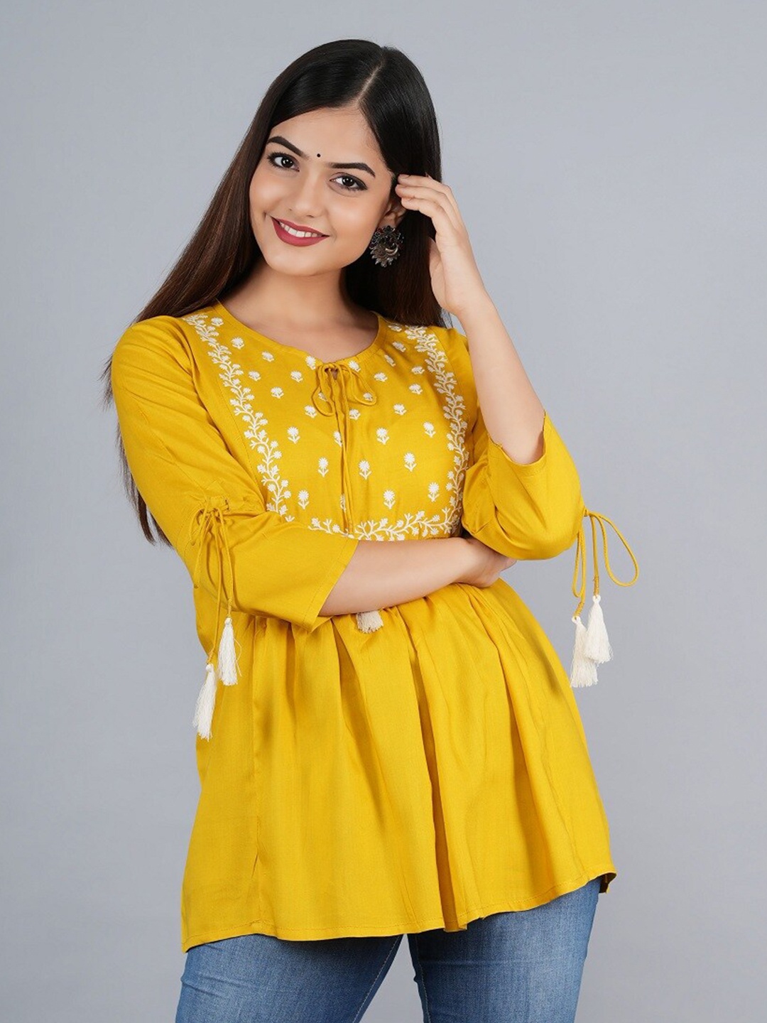 

Ashlee Women Mustard Yellow & White Floral Embroidered Tie-Up Neck Empire Top