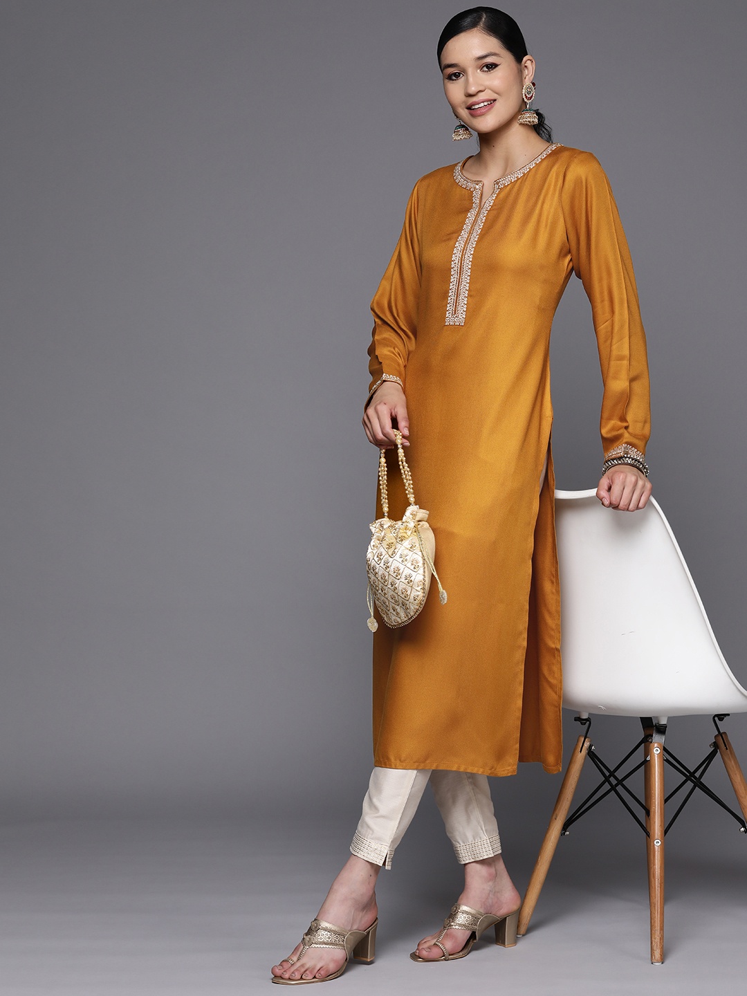 

Libas Women Mustard Pashmina Wool Embroidered Detail Straight Kurta