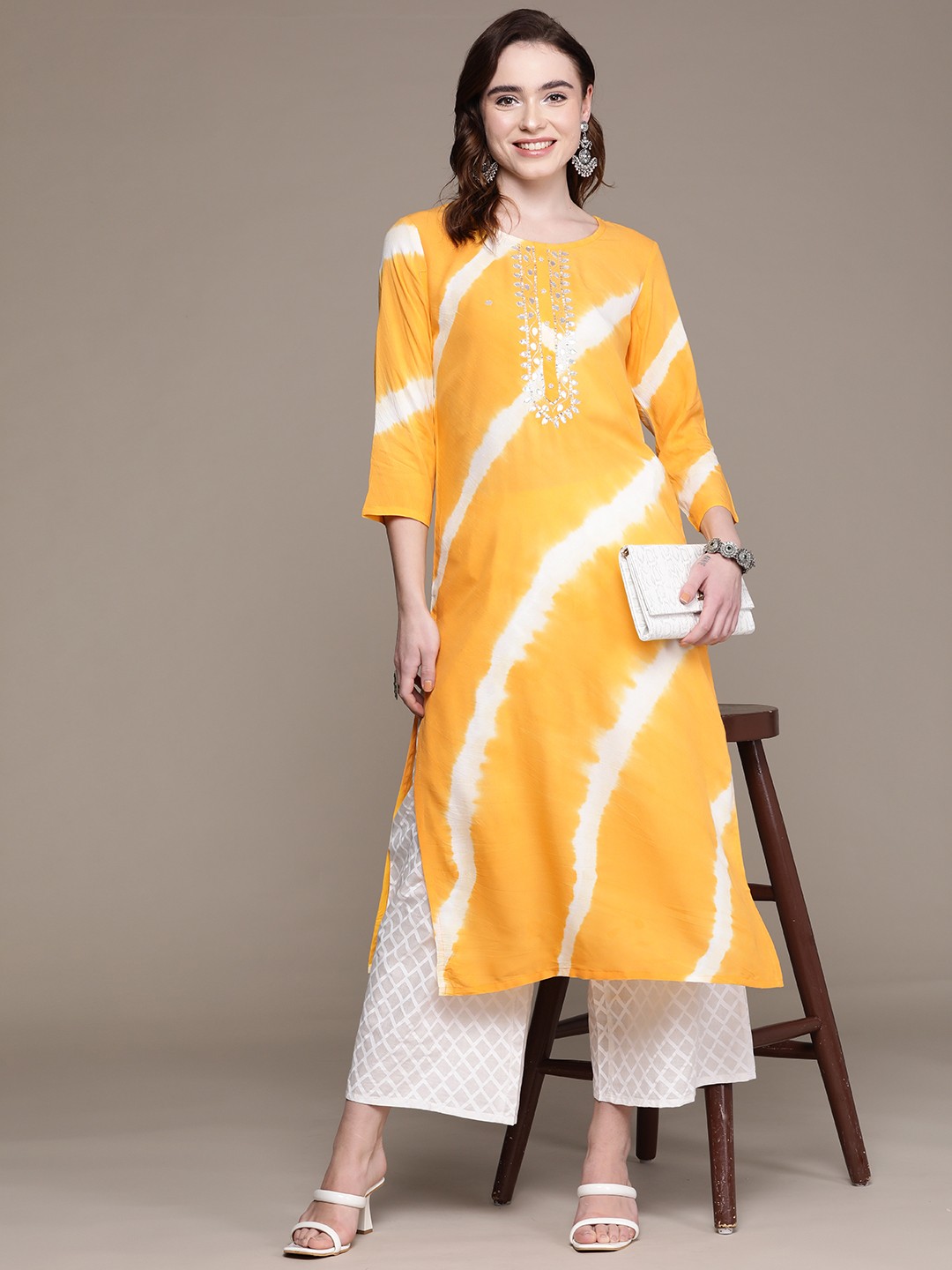 

Anubhutee Women Yellow Printed Mirror Work Kurta with Palazzos