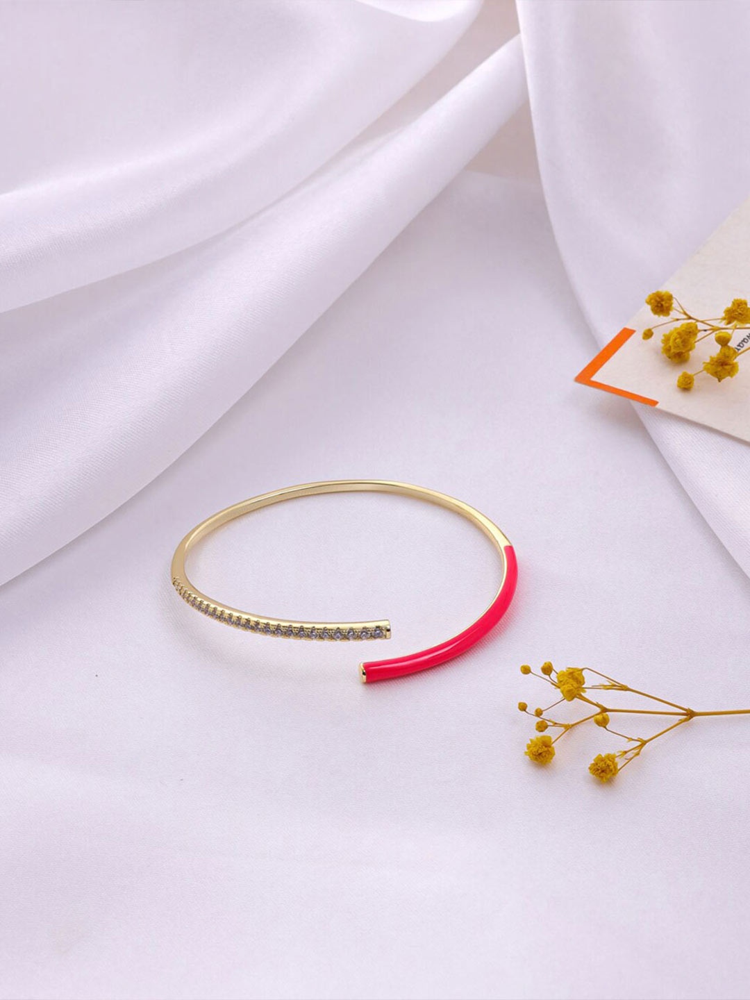 

Mitali Jain Women Gold-Toned & Pink Brass Cubic Zirconia Gold-Plated Cuff Bracelet