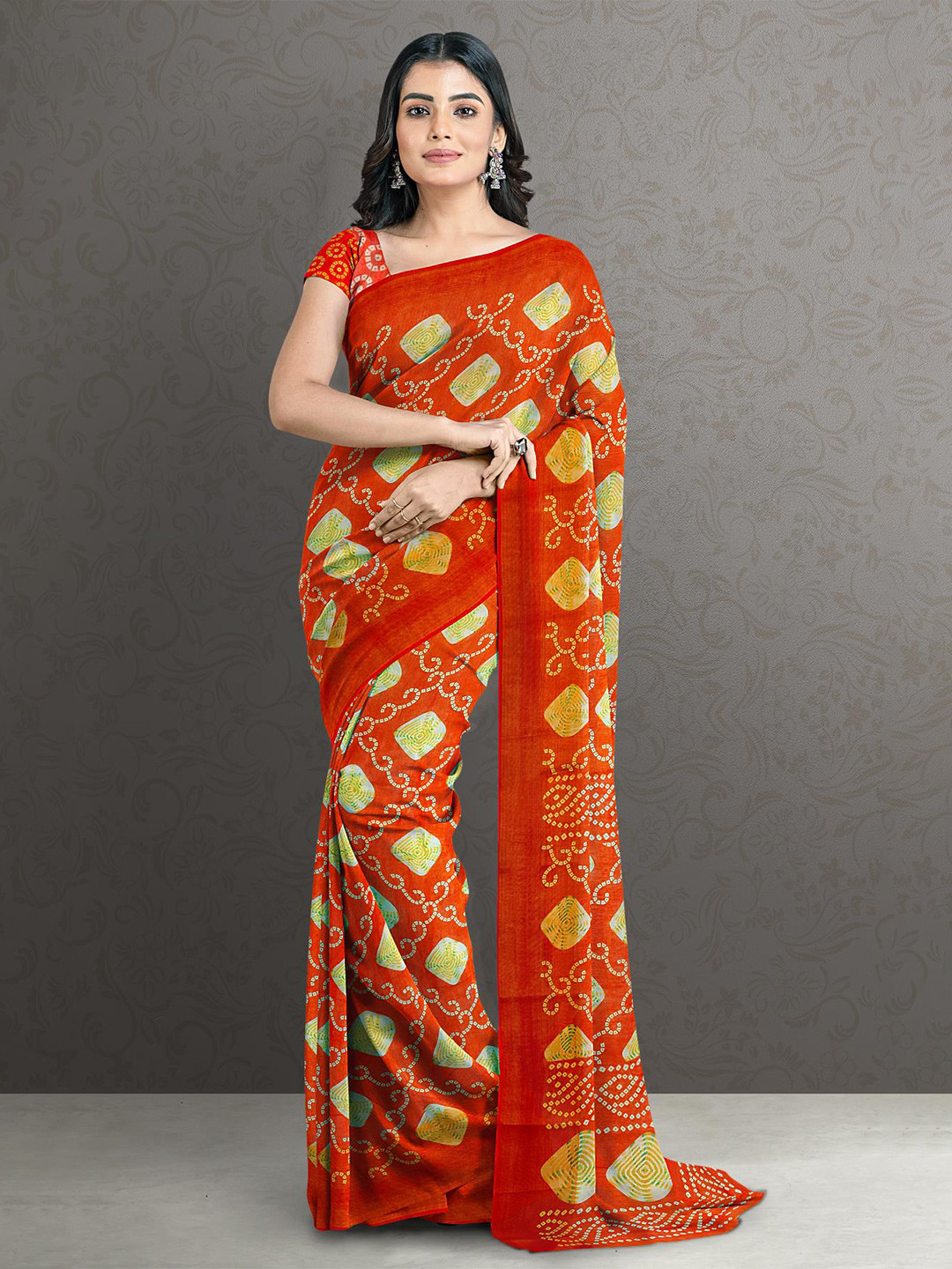 

Kalamandir Orange & Green Printed Bandhani Saree