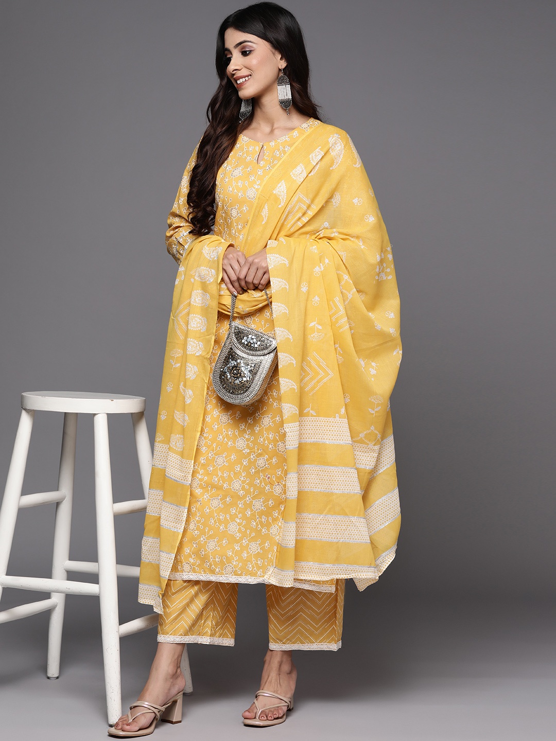 

Indo Era Women Yellow Floral Print Kurta with Palazzos & With Dupatta