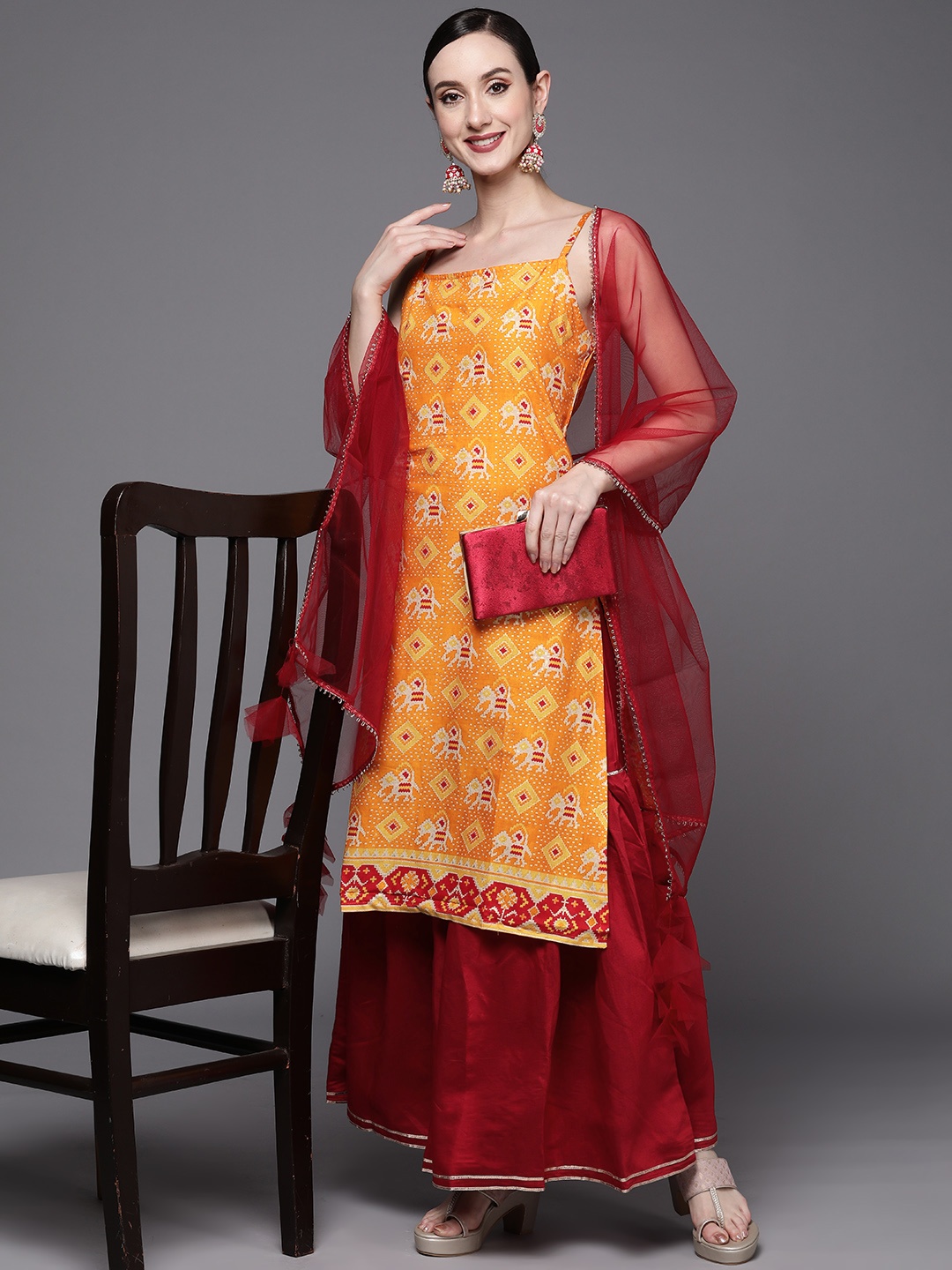 

Indo Era Women Orange Ethnic Motifs Printed Kurta with Sharara & With Dupatta