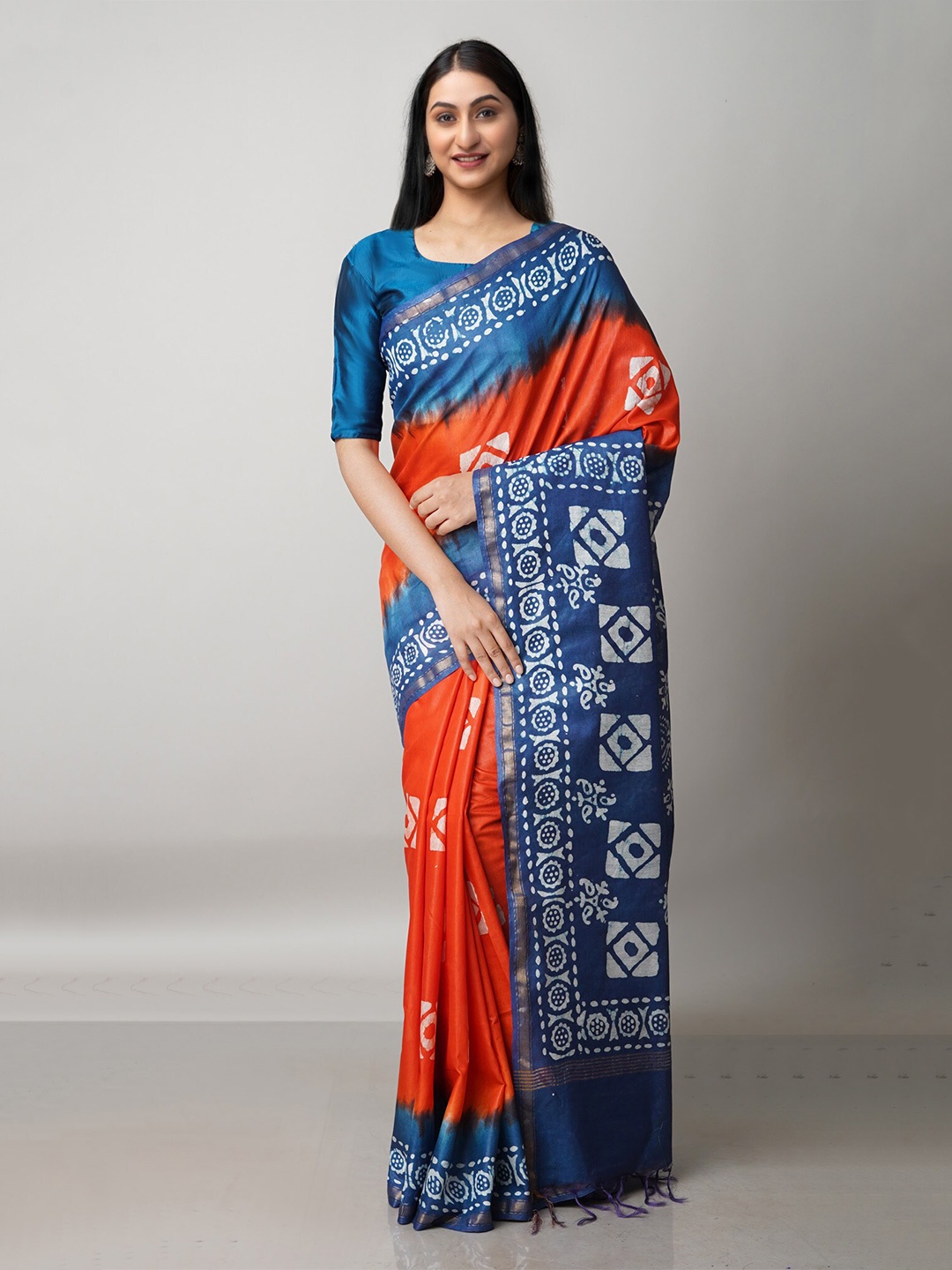 

Unnati Silks Orange & Navy Blue Batik Zari Pure Silk Handloom Chanderi Saree