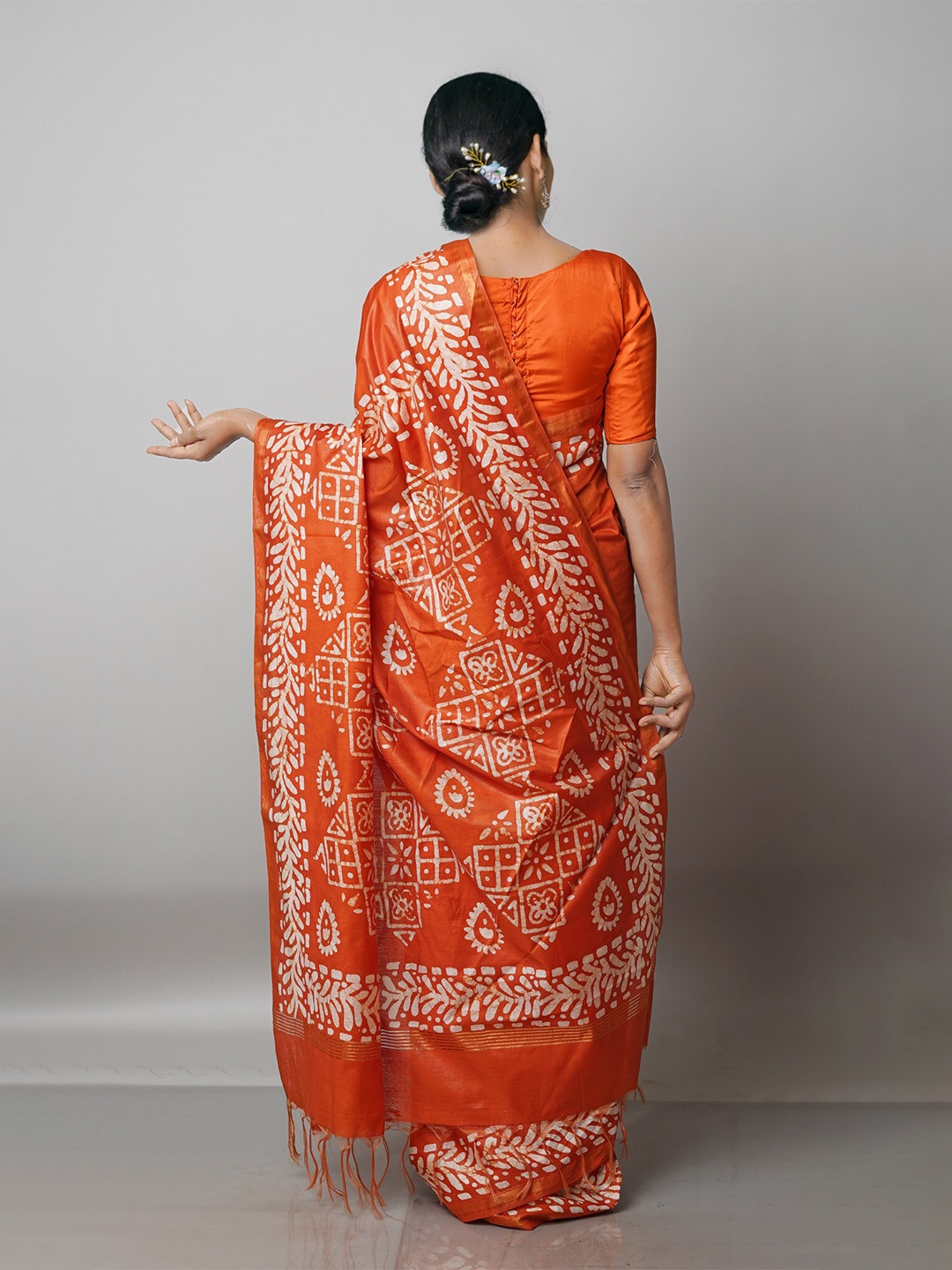 

Unnati Silks Orange & White Batik Zari Pure Silk Handloom Chanderi Saree
