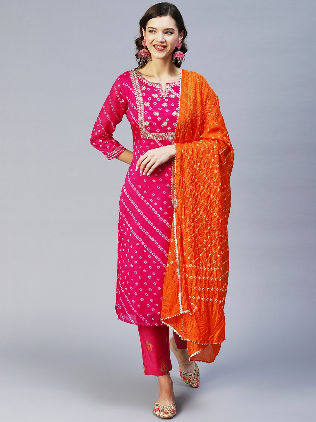 

FASHOR Women Pink Bandhani Printed Silk Chiffon Kurta With Trousers & With Dupatta