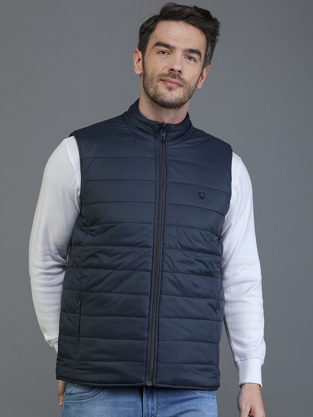 

TQS Men Navy Blue Windcheater and Water Resistant Sleeveless Padded Jacket