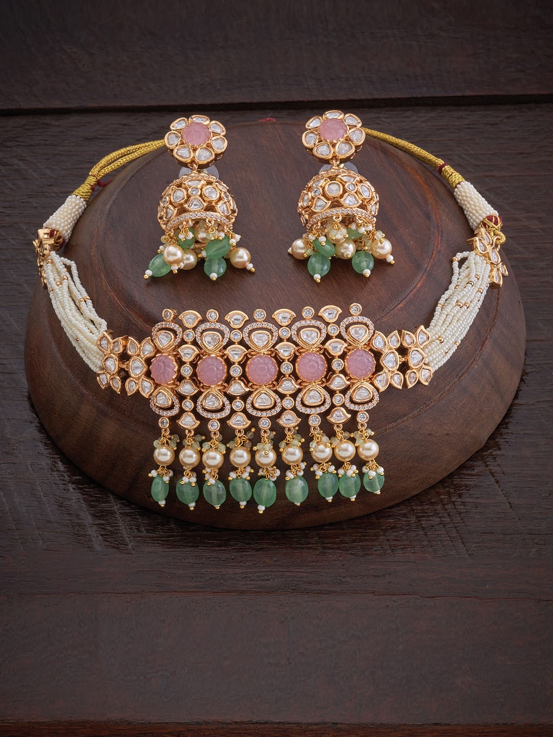 

Kushal's Fashion Jewellery Gold-Toned White & Pink Stone-Studded & Pearl Beaded Jewellery Set