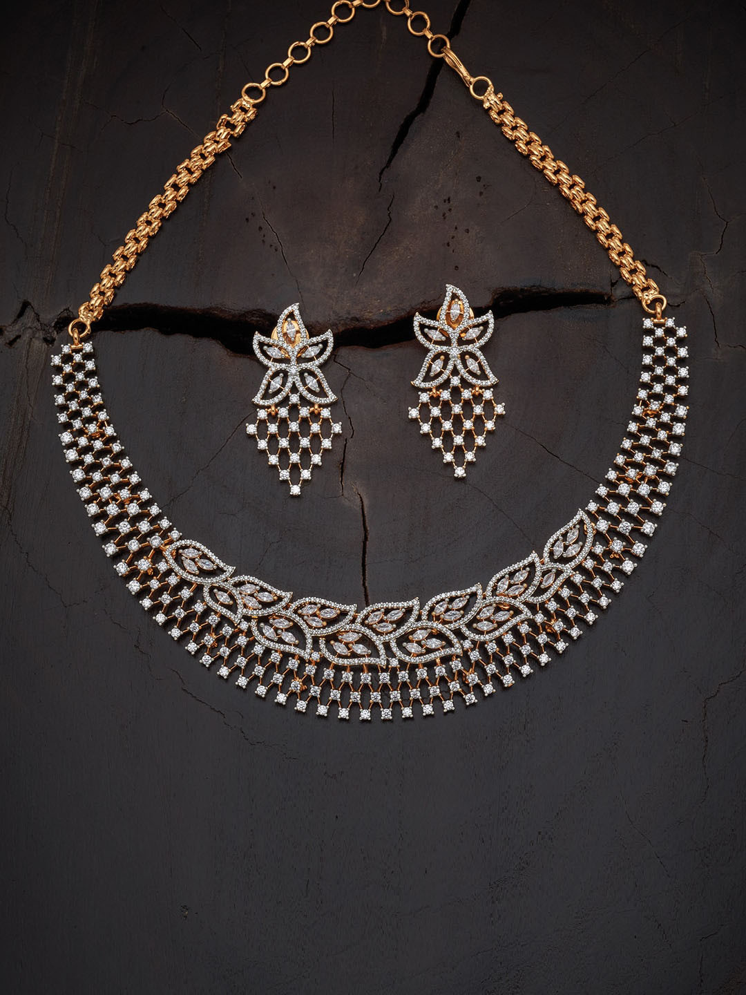 

Kushal's Fashion Jewellery women Gold-Plated White Stone-Studded Jewellery Set