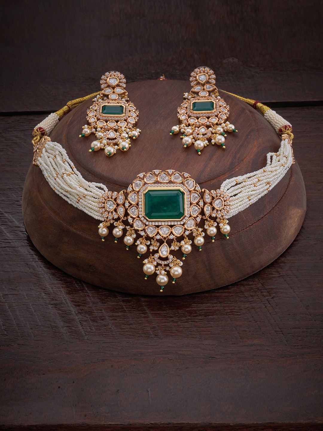 

Kushal's Fashion Jewellery Gold-Plated & White Kundan Studded & Beaded Jewellery Set