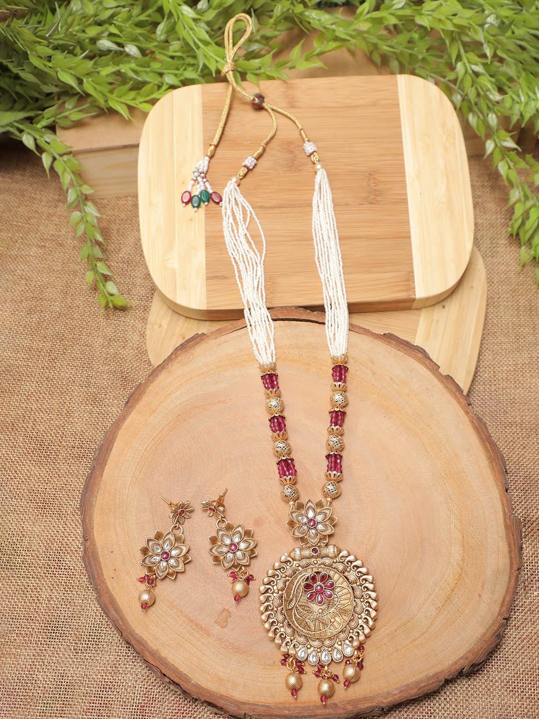 

Swarajshop Gold-Plated Maroon & White Stone Studded & Pearls Beaded Jewellery Set