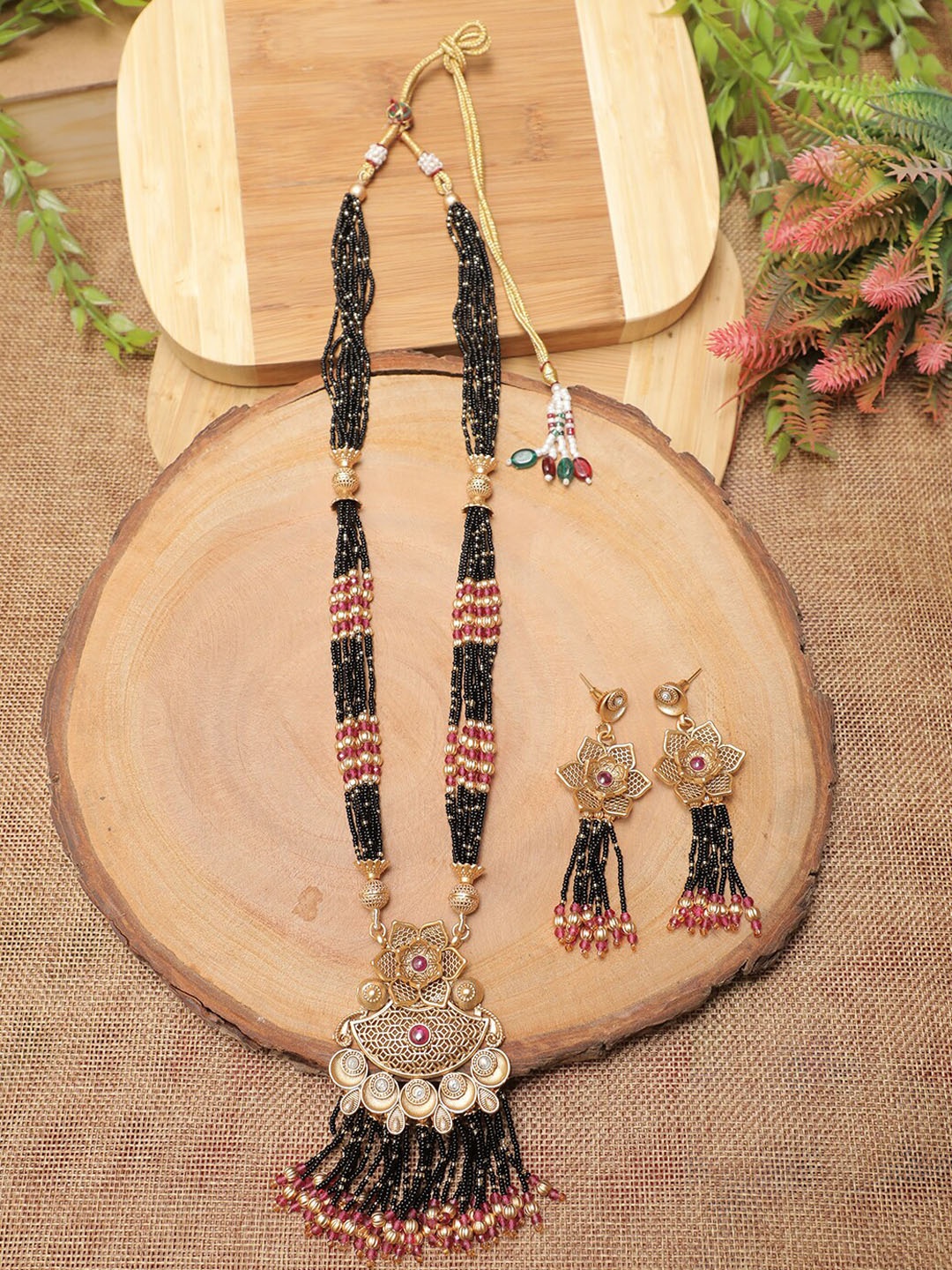 

Swarajshop Gold-Plated Black & White Stone Studded & Pearls Beaded Jewellery Set