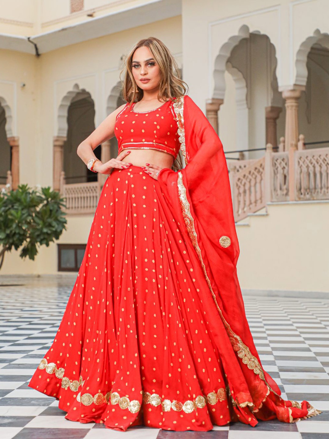 

Baisacrafts Red & Gold-Toned Bandhani Printed Sequinned Lehenga Choli With Dupatta