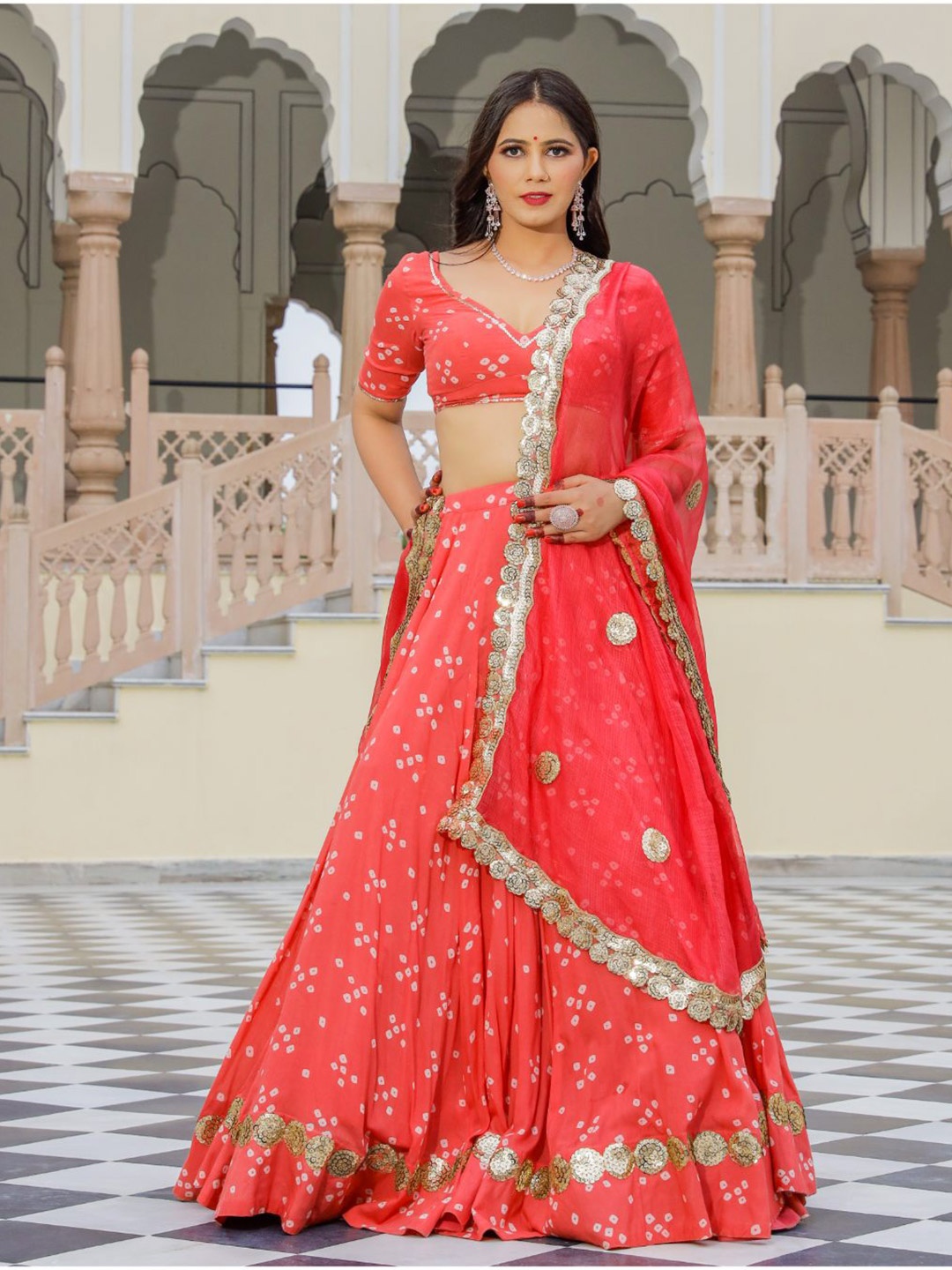 

Baisacrafts Coral & Gold-Toned Bandhani Printed Lehenga Choli With Dupatta