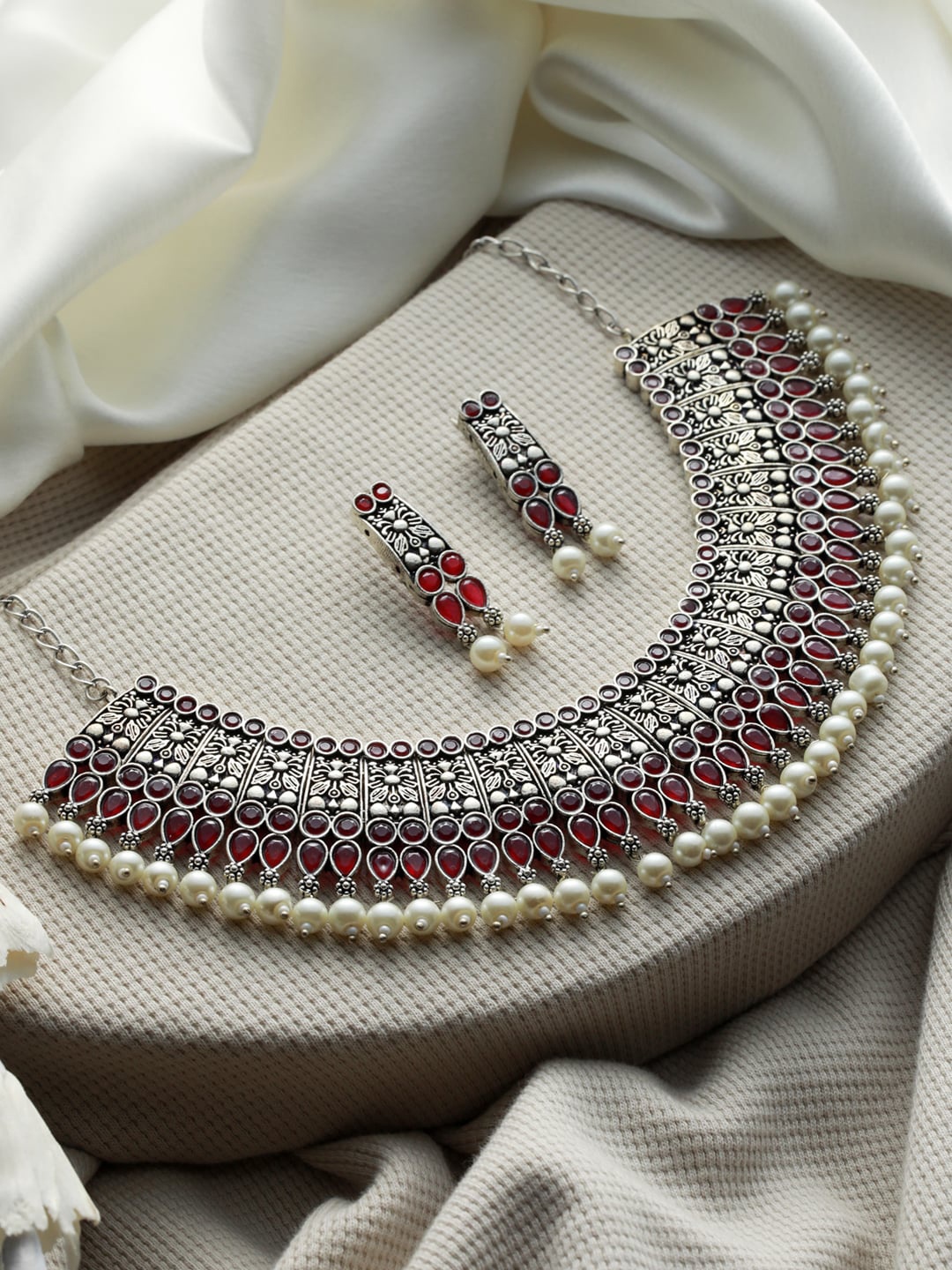 

Priyaasi Silver-Toned & Pink Stone-Studded with Pearl Beaded Silver-Plated Jewellery Set