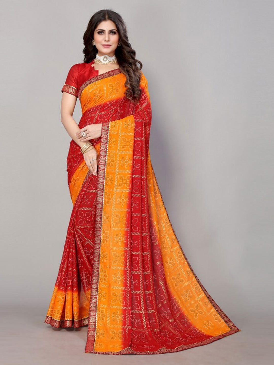 

Yashika Red & Orange Bandhani Printed Poly Georgette Saree