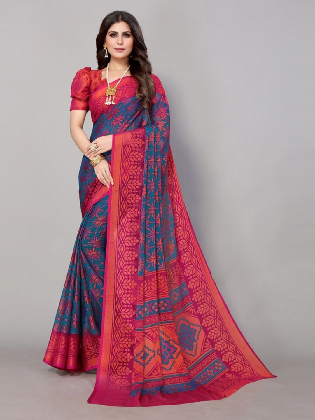 

Yashika Blue & Pink Floral Printed Poly Chiffon Saree