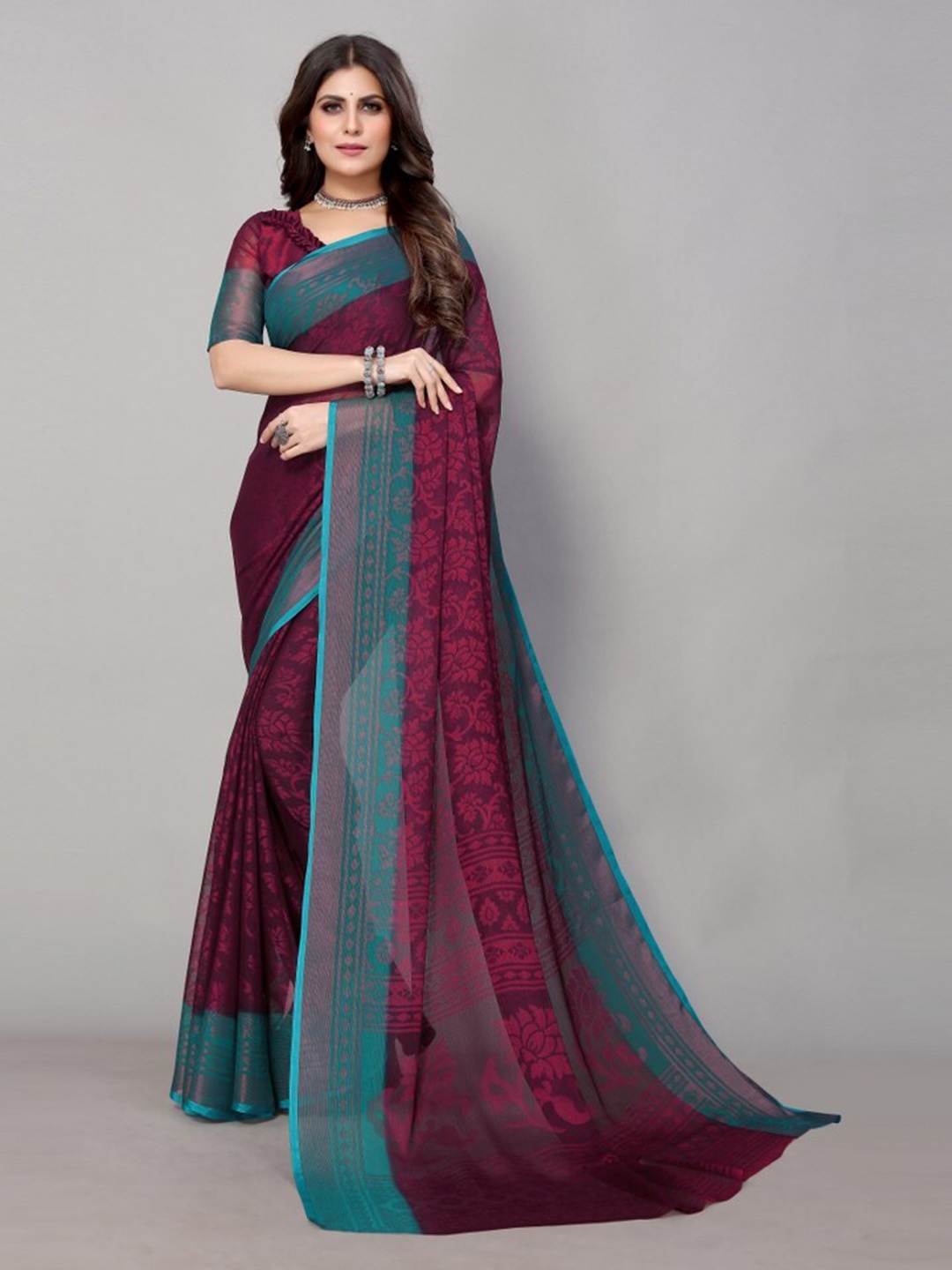 

Yashika Maroon & Blue Floral Printed Zari Poly Chiffon Saree