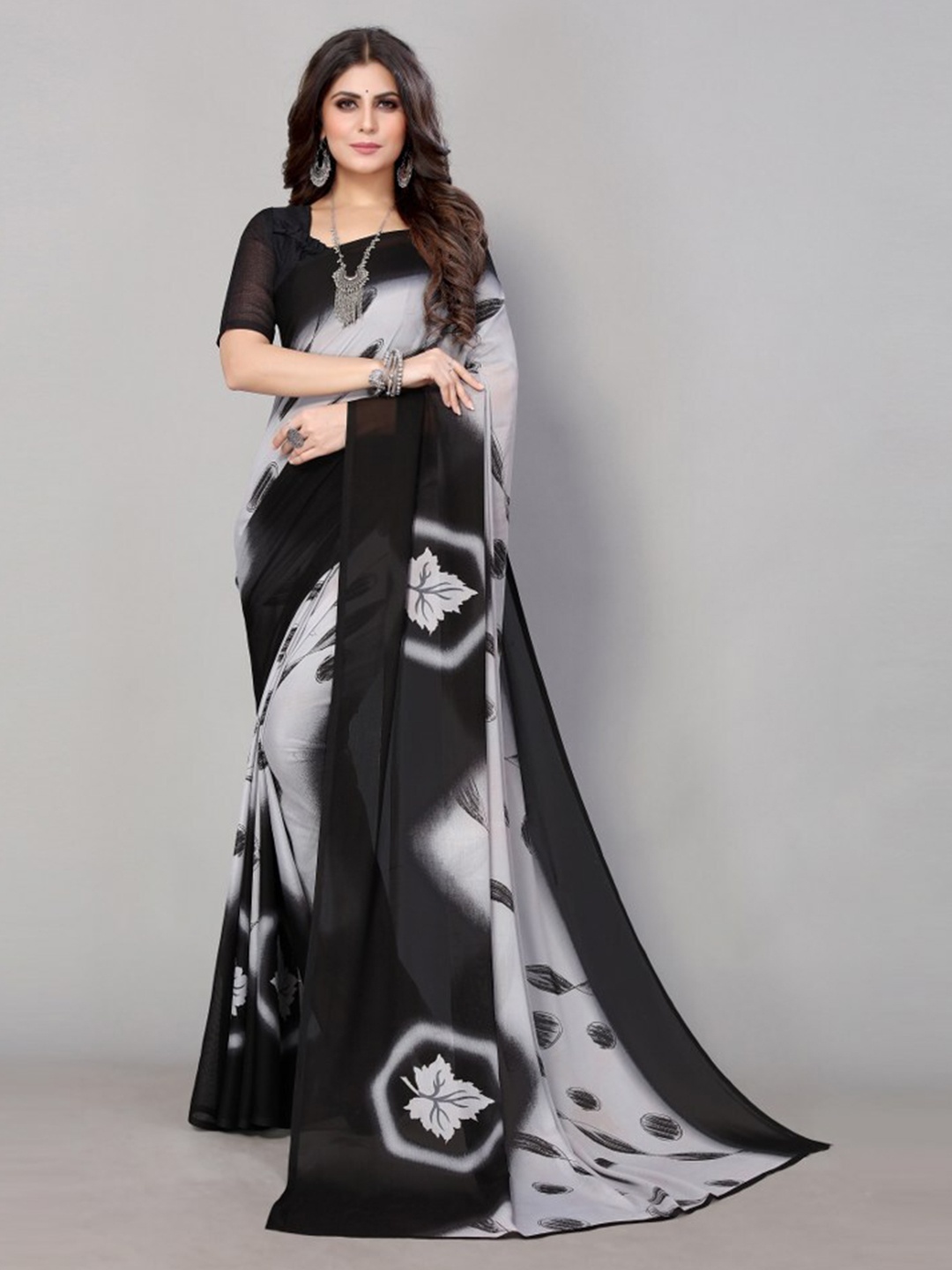 

Yashika Black & Black Floral Printed Poly Georgette Saree