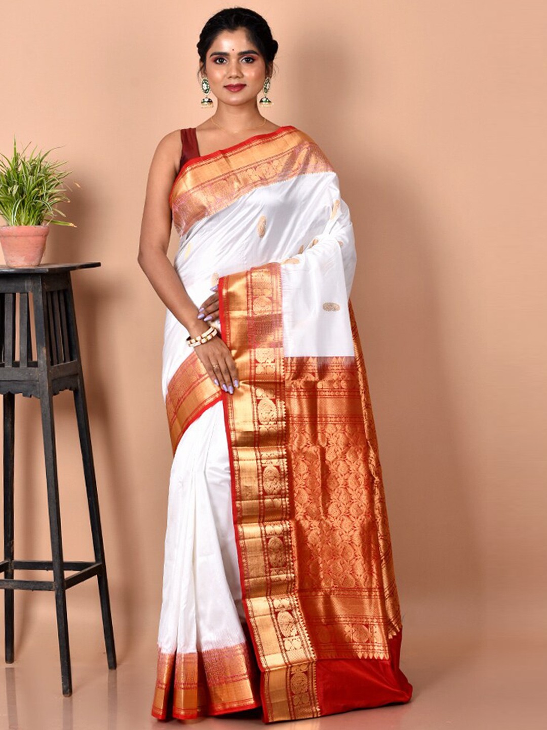 

AllSilks White & Red Ethnic Motifs Zari Pure Silk Kanjeevaram Saree
