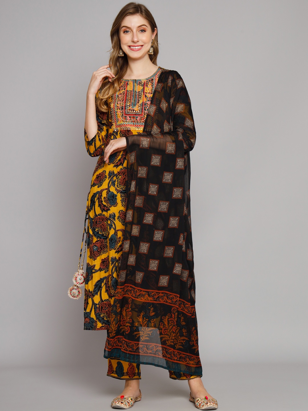 

Nehamta Mustard Yellow Floral Embroidered Thread Work Kurta With Trouser & With Dupatta