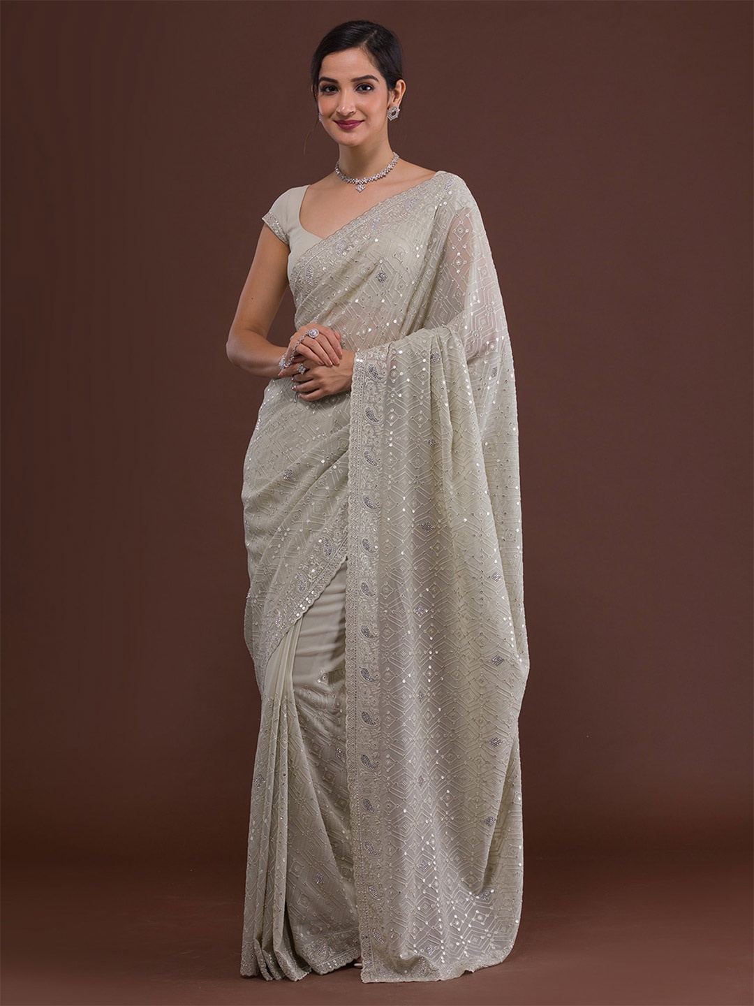 

Koskii Off White Ethnic Motifs Embroidered Saree