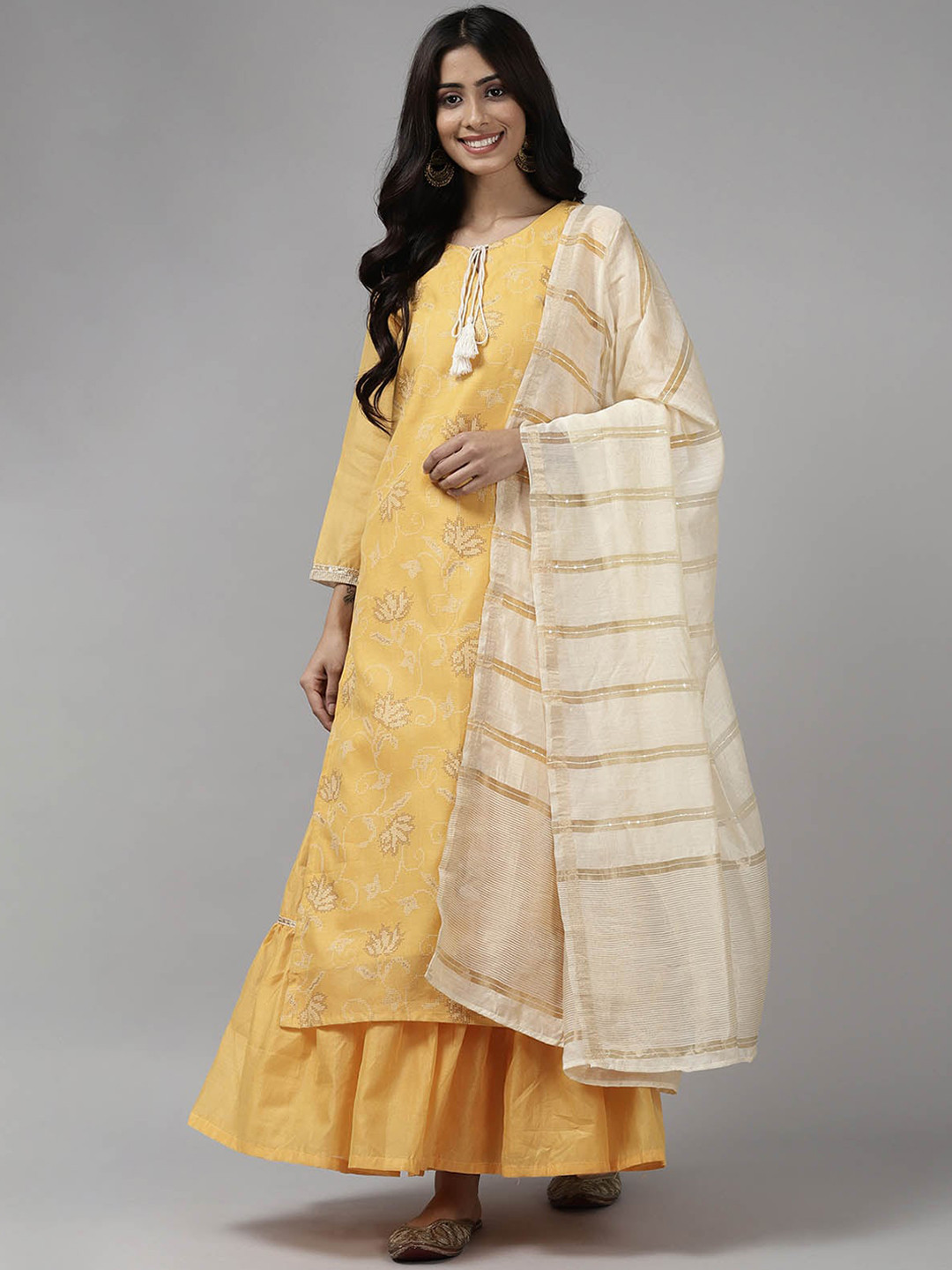 

ODETTE Women Yellow Floral Printed Chanderi Silk Kurta with Sharara & With Dupatta