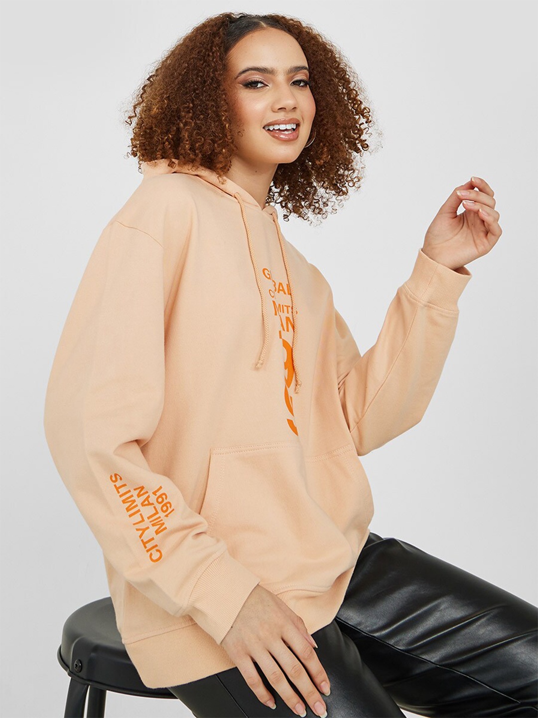 

Styli Women Peach-Coloured Printed Hooded Cotton Sweatshirt