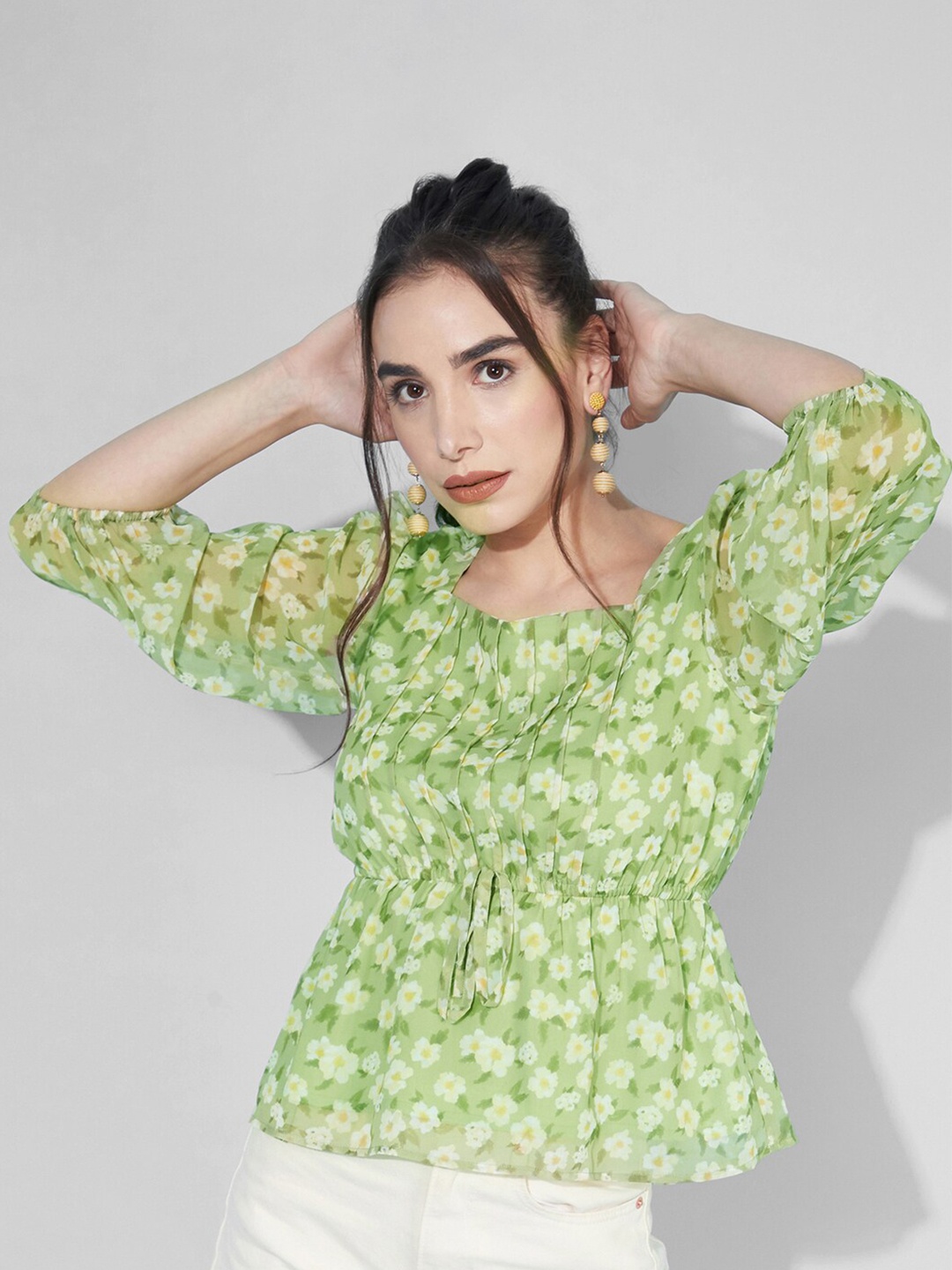 

Selvia Green Floral Print Georgette Peplum Top