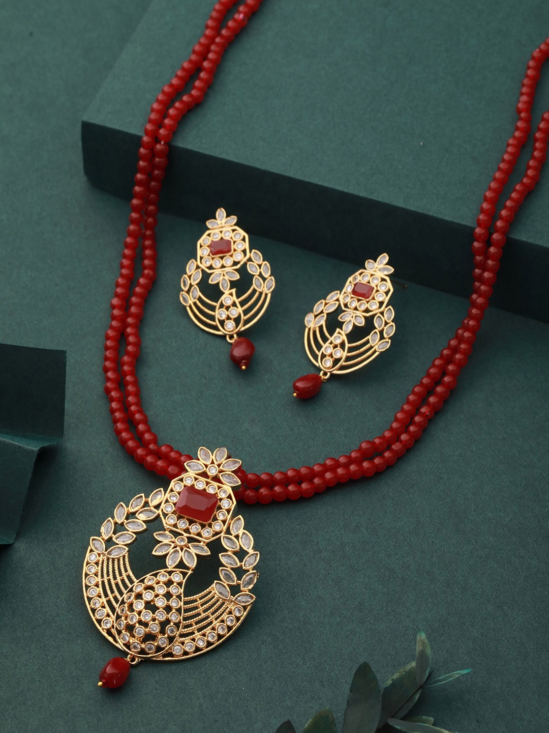 

Saraf RS Jewellery Gold-Plated Red & White AD Studded & Beaded Jewellery Set