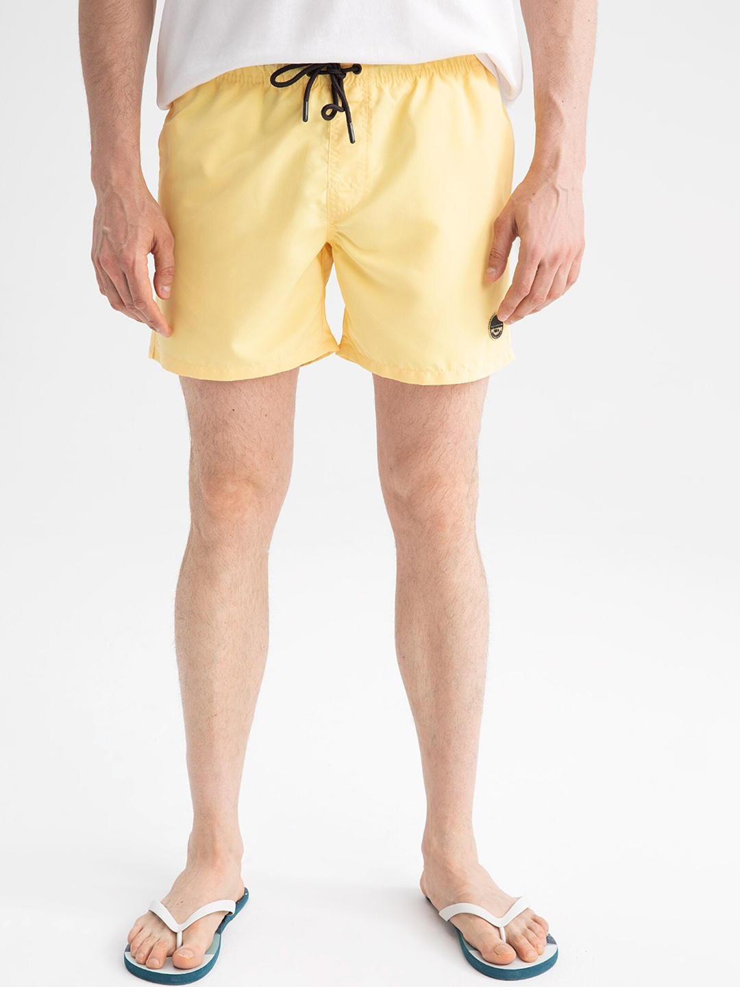 

DeFacto Men Yellow Solid Mid-Rise Swim Shorts