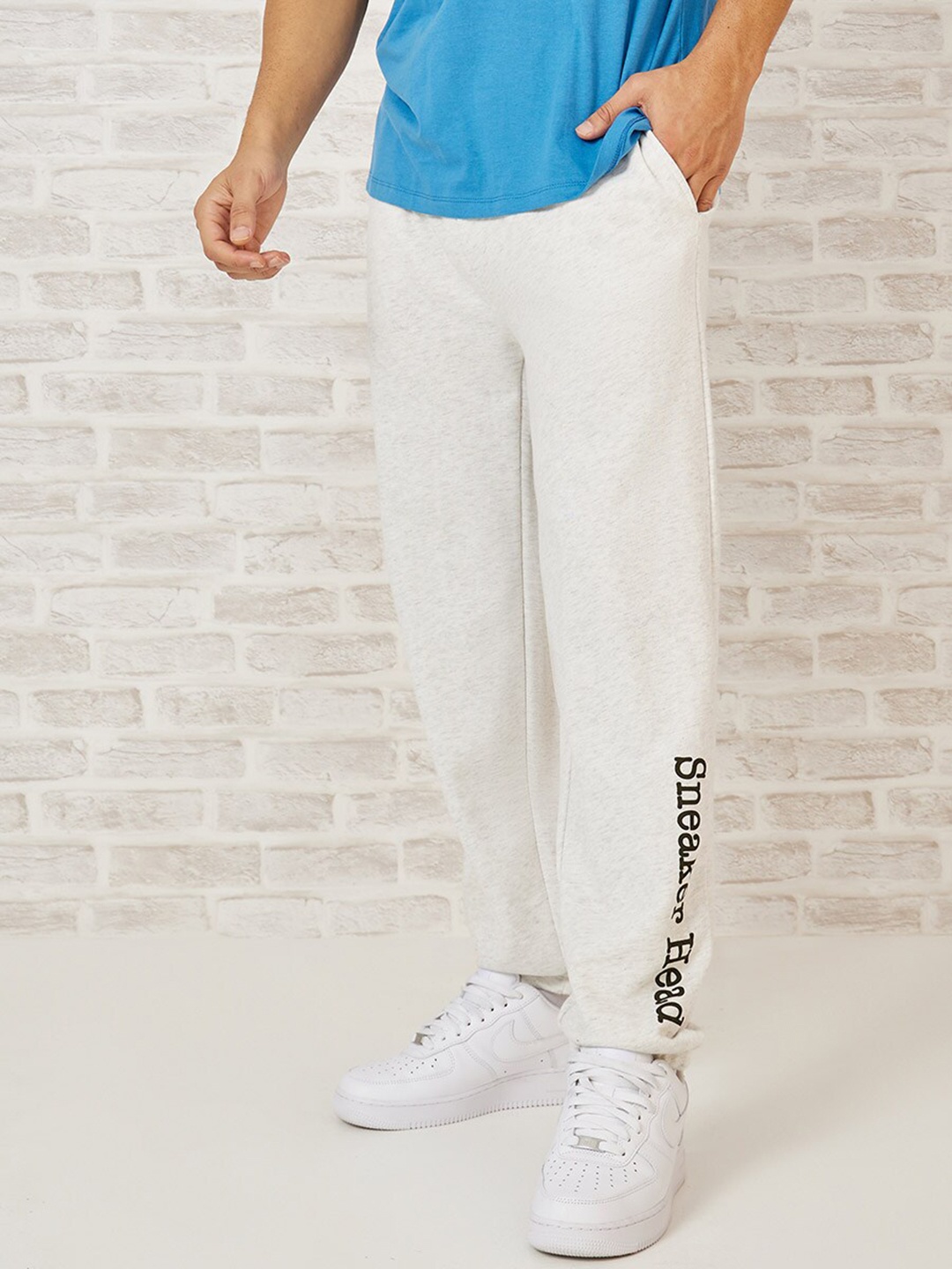 

Styli Men Printed Relaxed Elasticated Hem Joggers, Cream