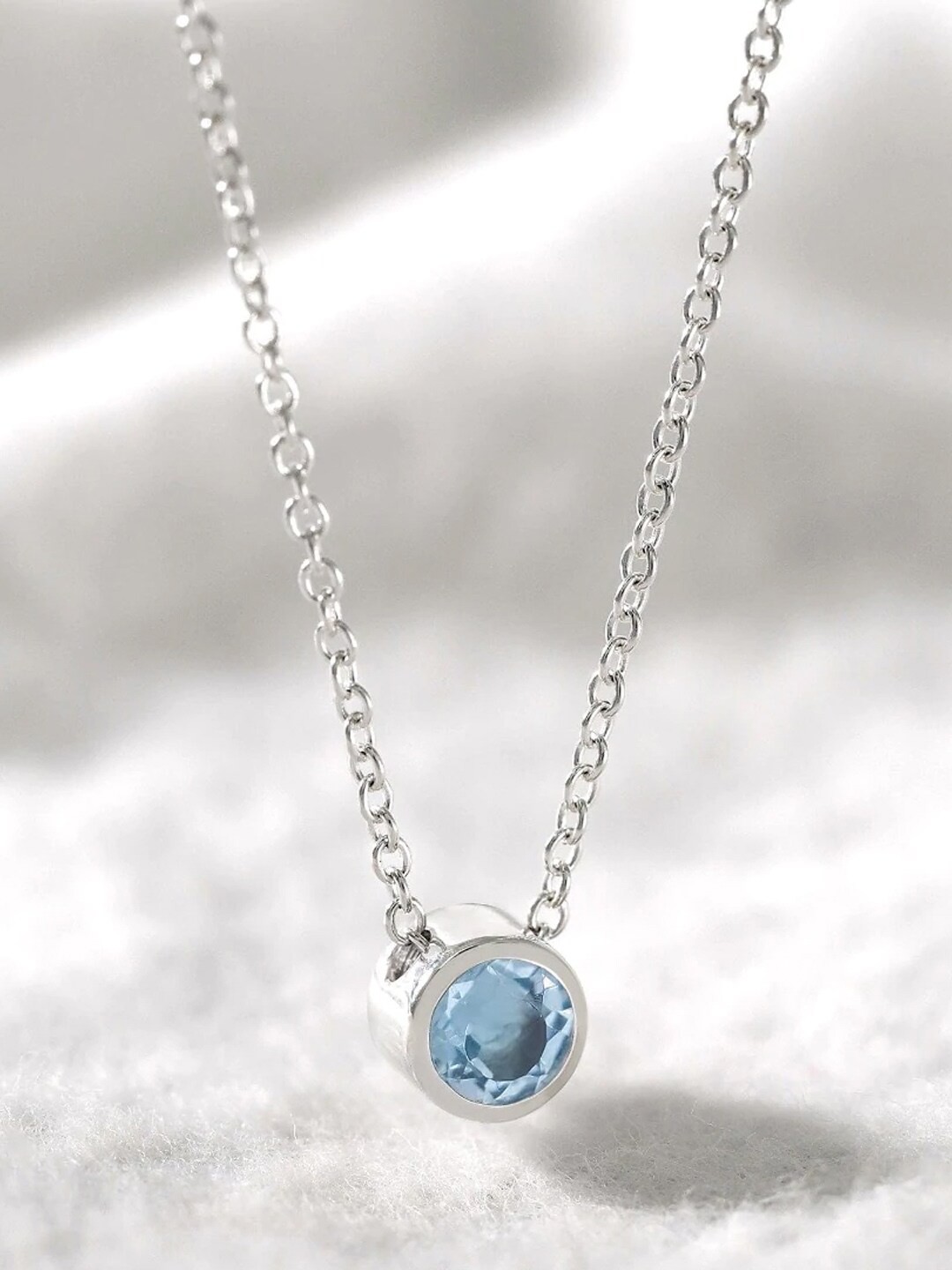 

Young & Forever Women Blue Crystal Birthstone Silver-Plated Pendant Necklace