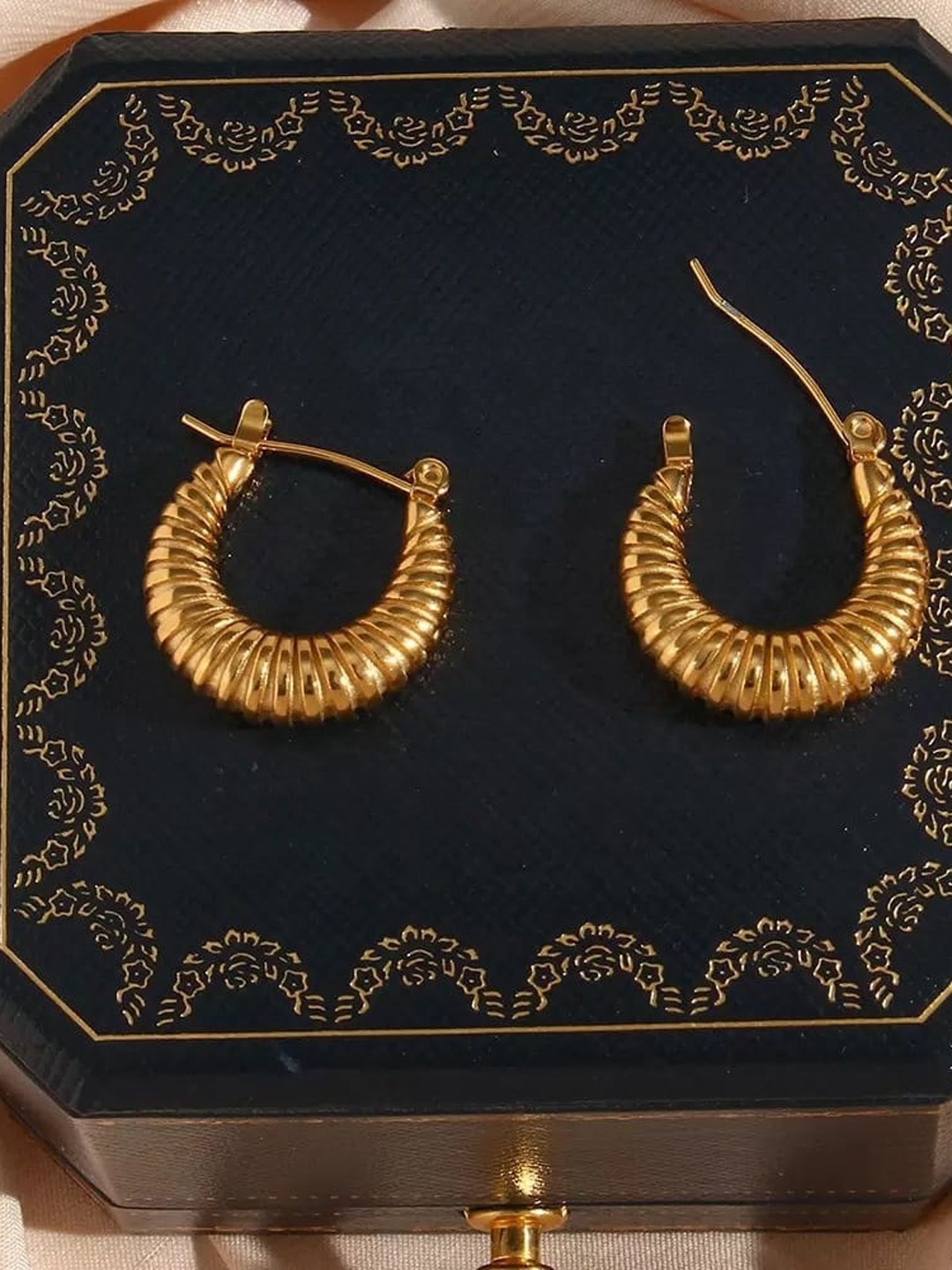 

Inaya Women Gold Plated Contemporary Hoop Earrings