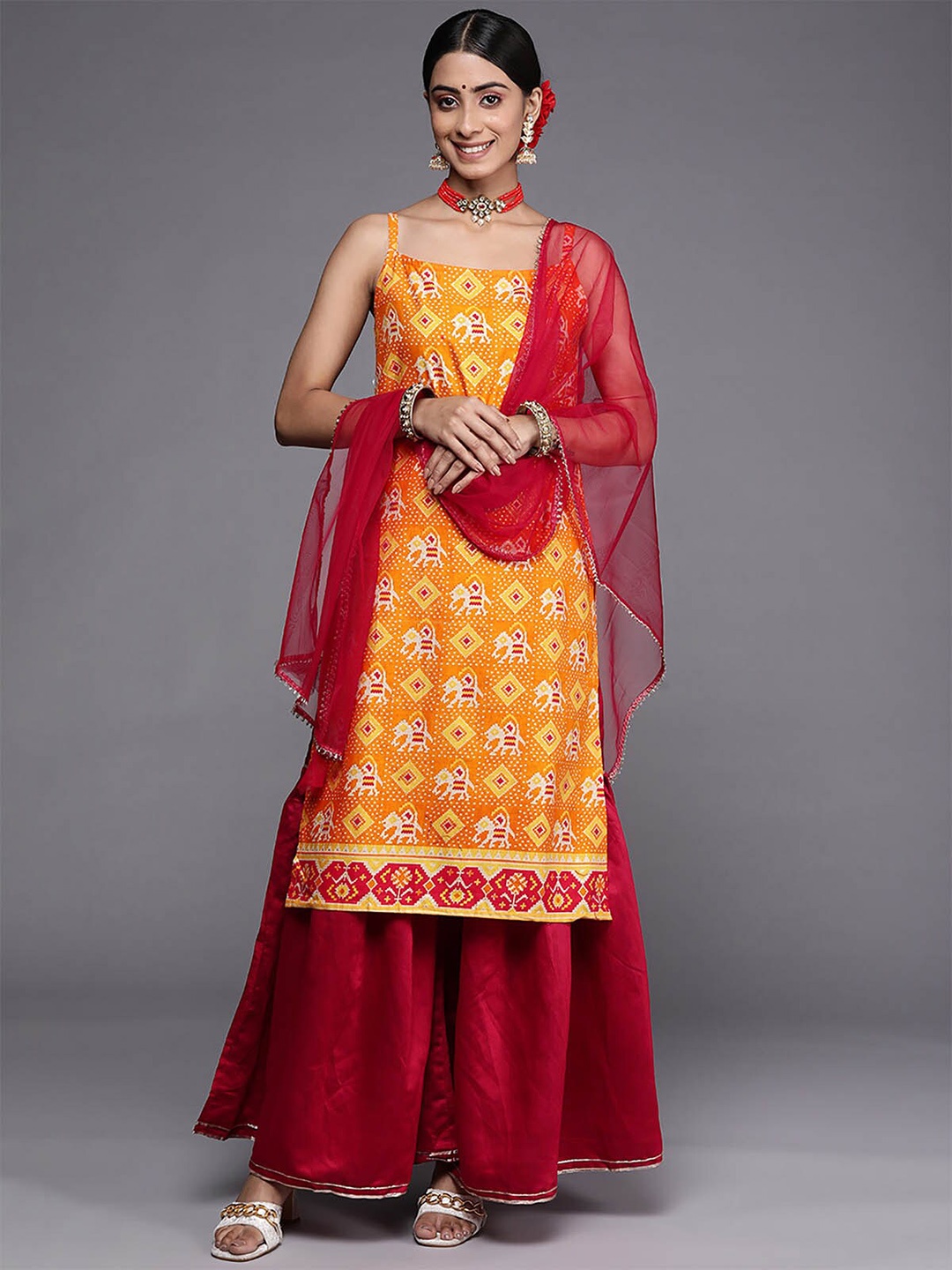 

ODETTE Orange Ethnic Motifs Printed Kurta with Sharara & With Dupatta